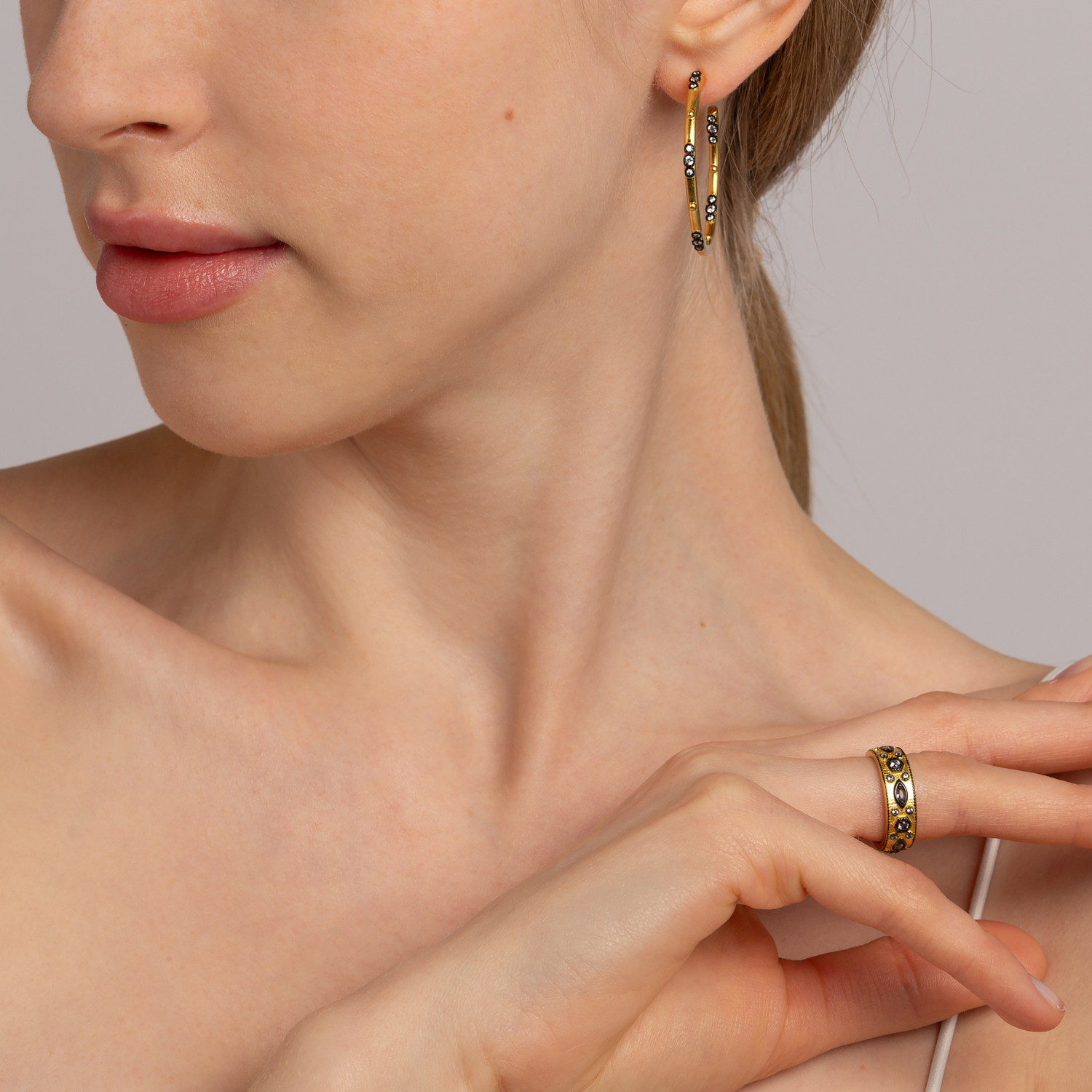 Model wearing 18k gold plated sterling silver cubic zirconia stacking ring