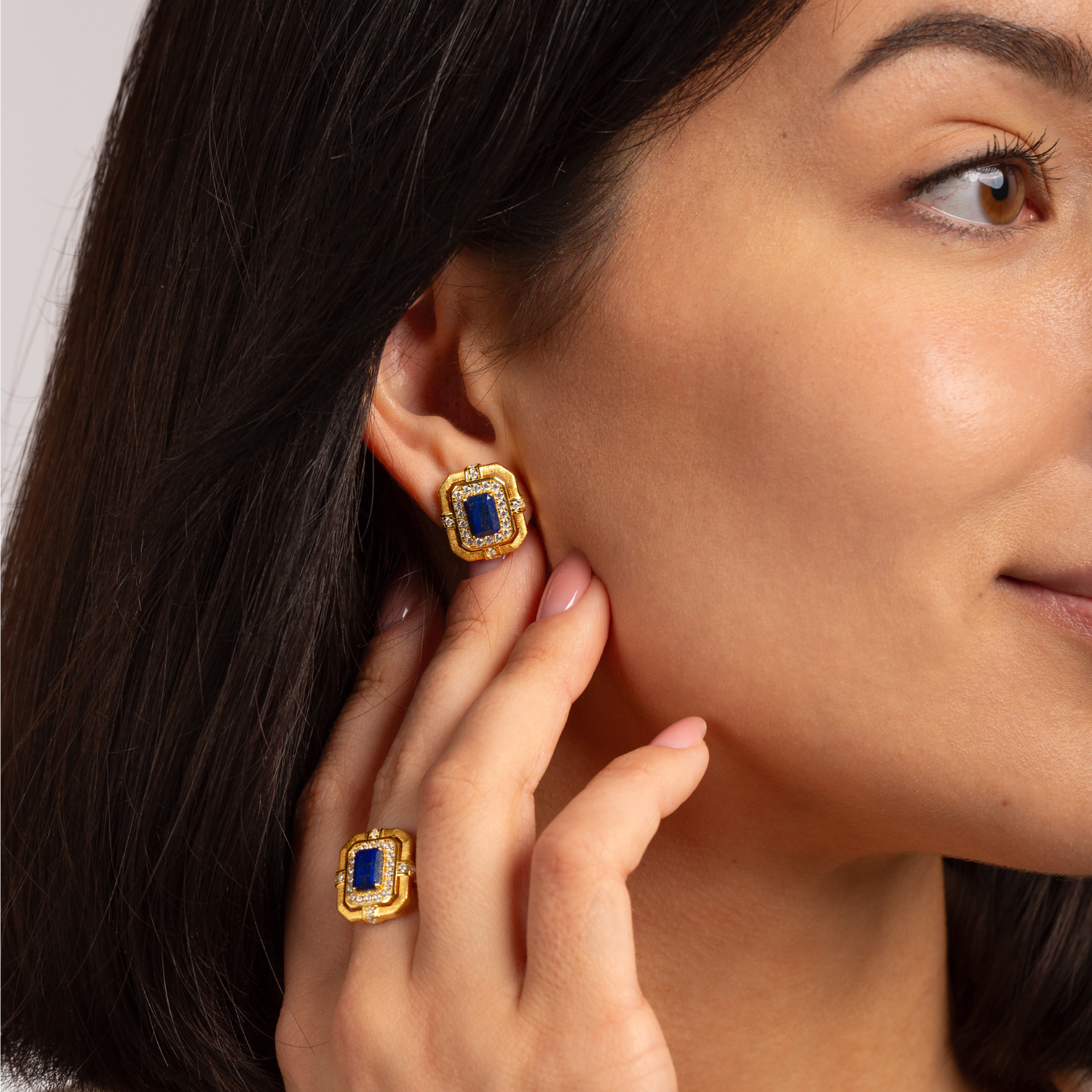 Model wearing 18k Gold plated 925 sterling silver lapis lazuli stud earrings, inspired by Greek goddess Hera