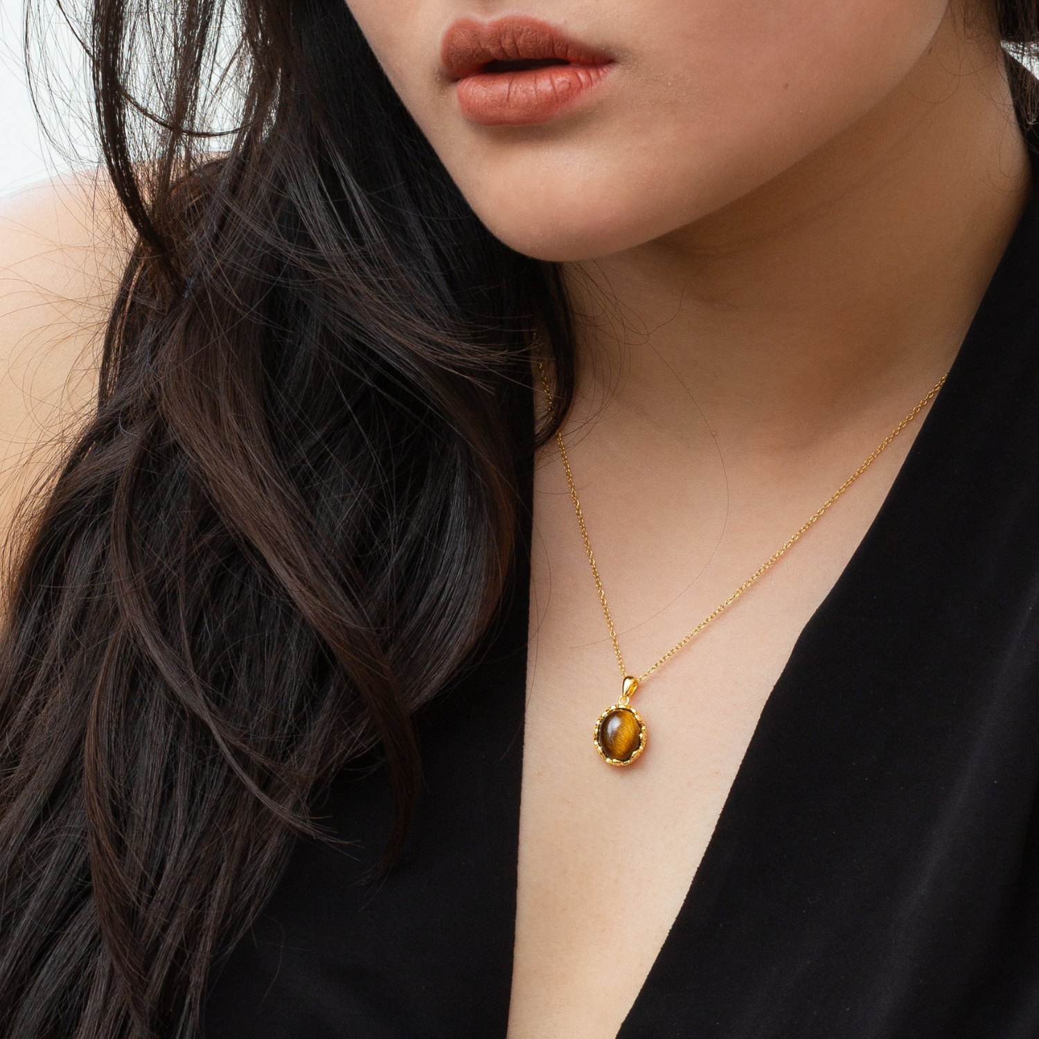Model wearing 18k gold plated 925 sterling silver tiger's eye necklace
