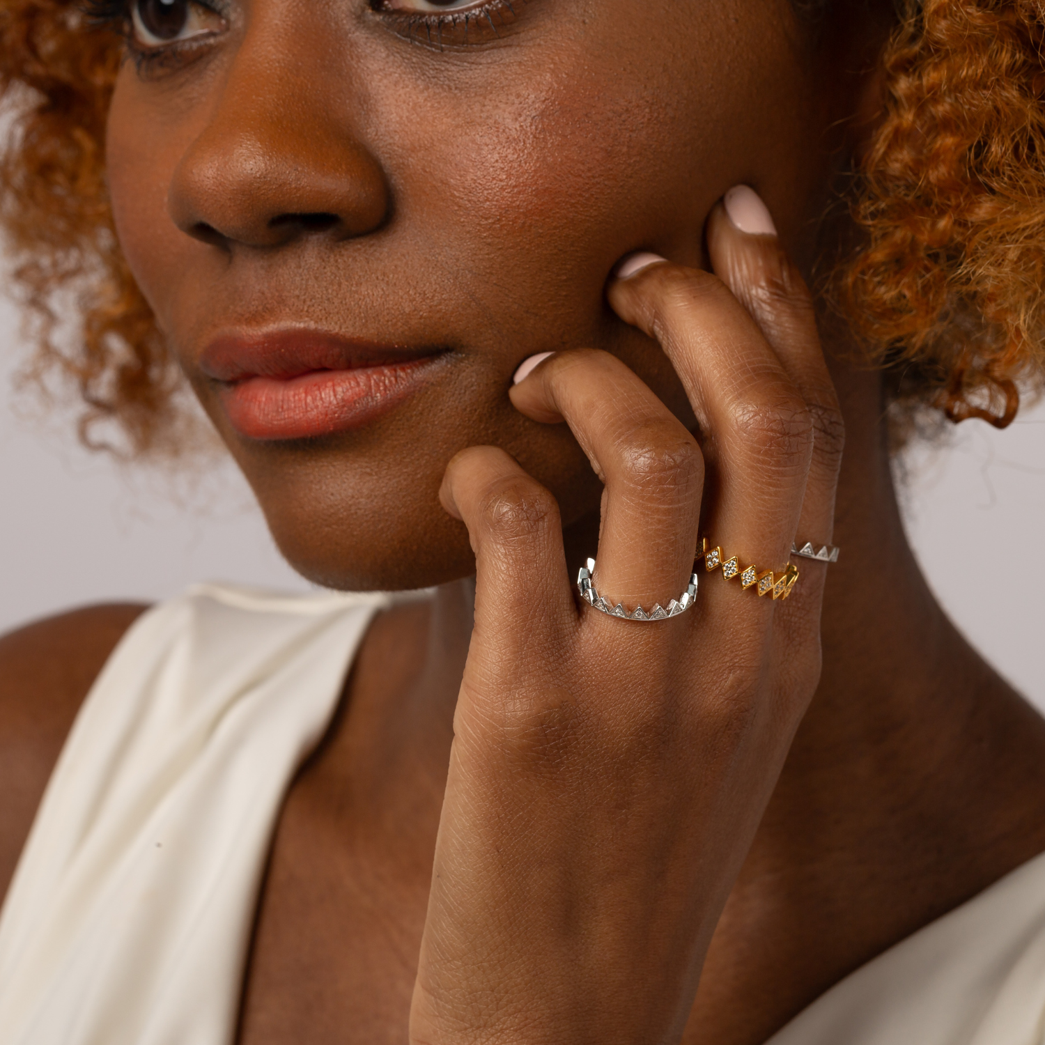 Model wearing 925 sterling silver crown stacking ring symbolising confidence and power