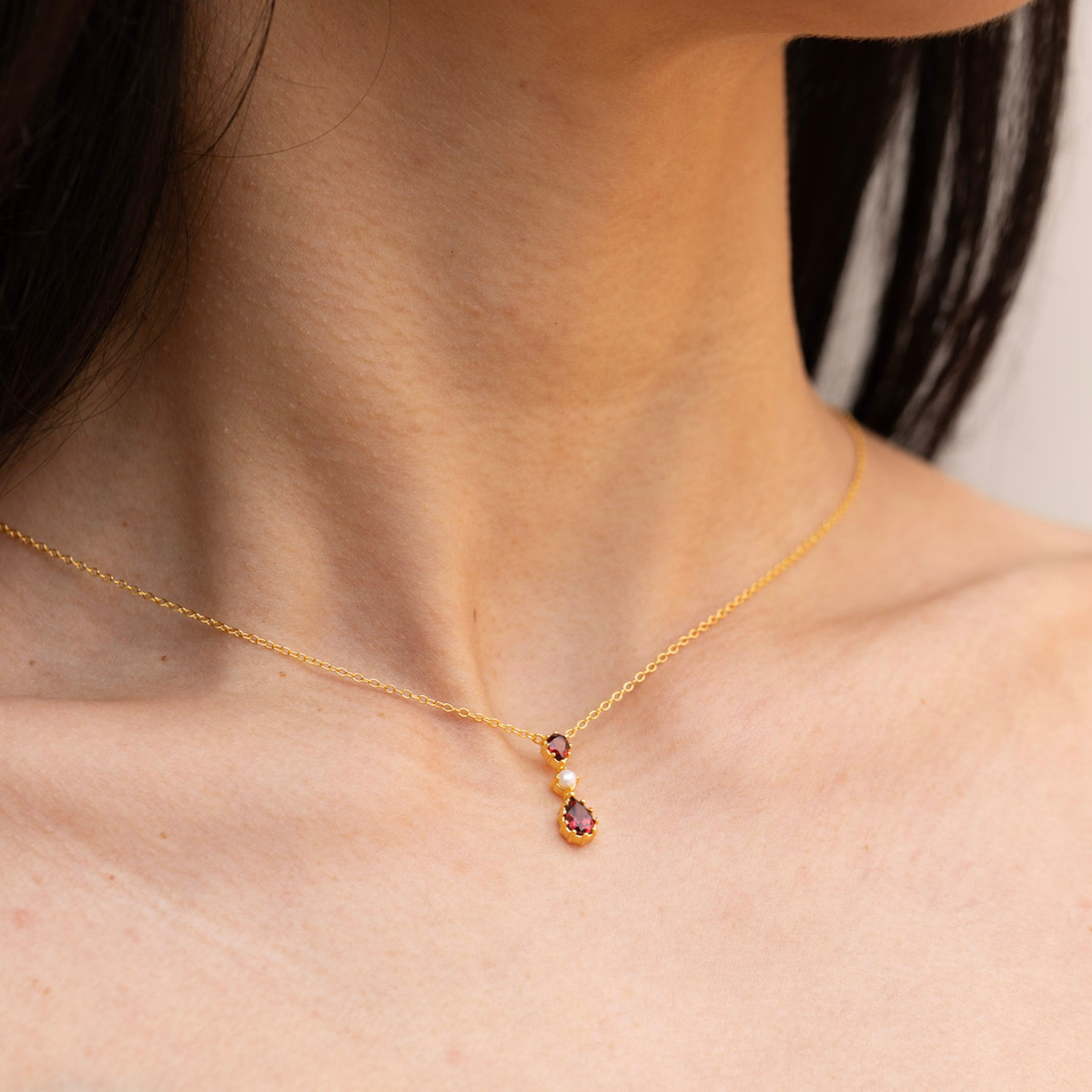model wearing 18k gold plated sterling silver garnet tiara necklace