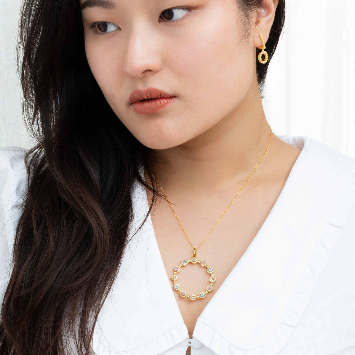 model wearing 18k gold 925 sterling silver multi gemstone necklace