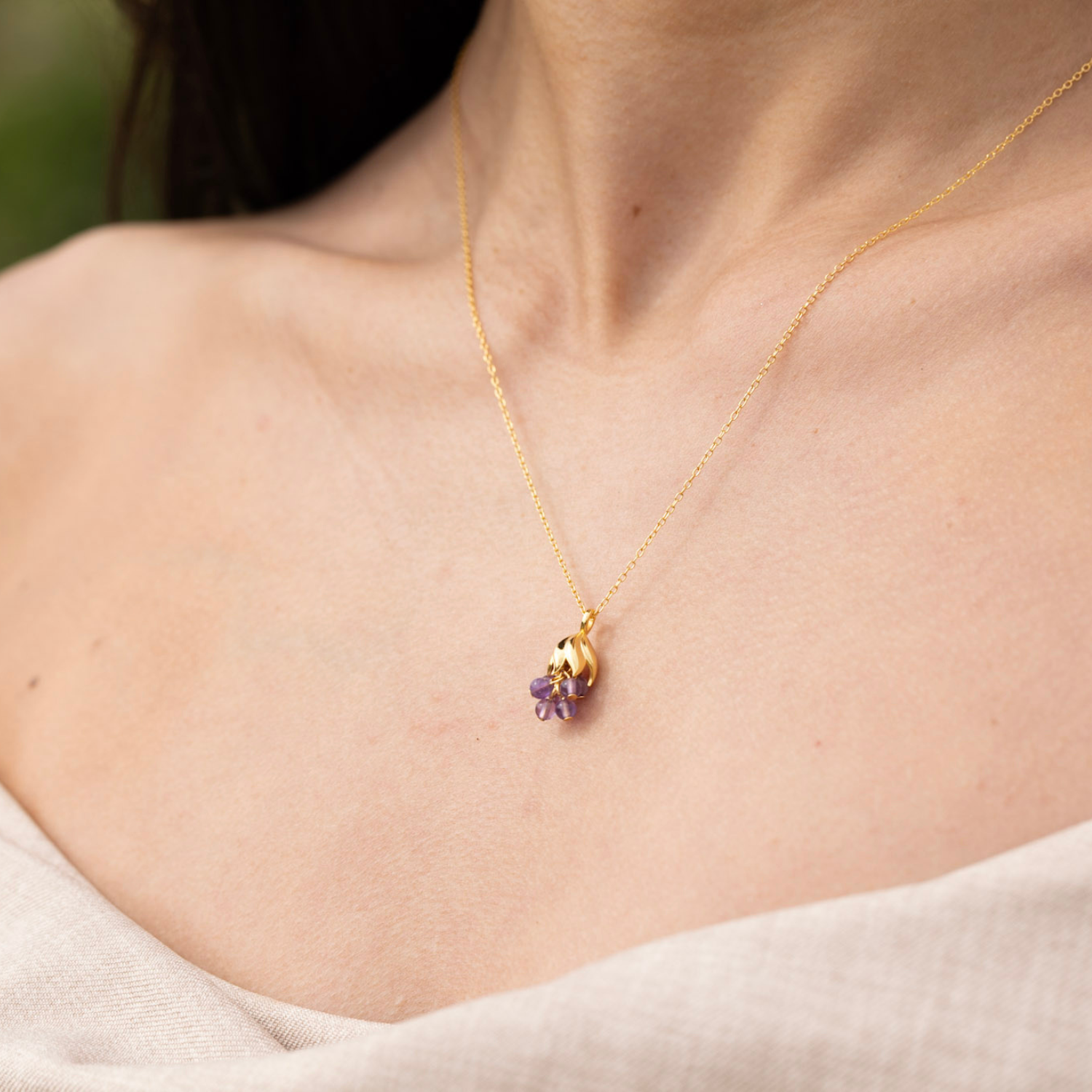 model wearing 18k gold plated sterling silver amethyst wisteria necklace