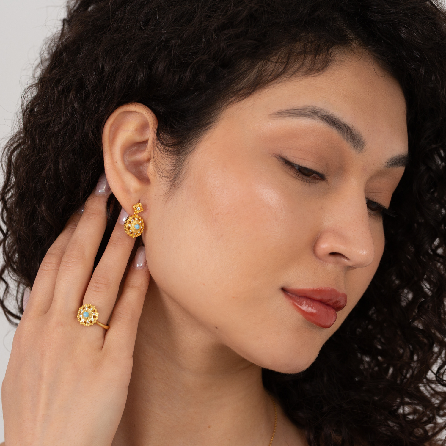 model wearing 18k gold plated sterling silver blue larimar earrings