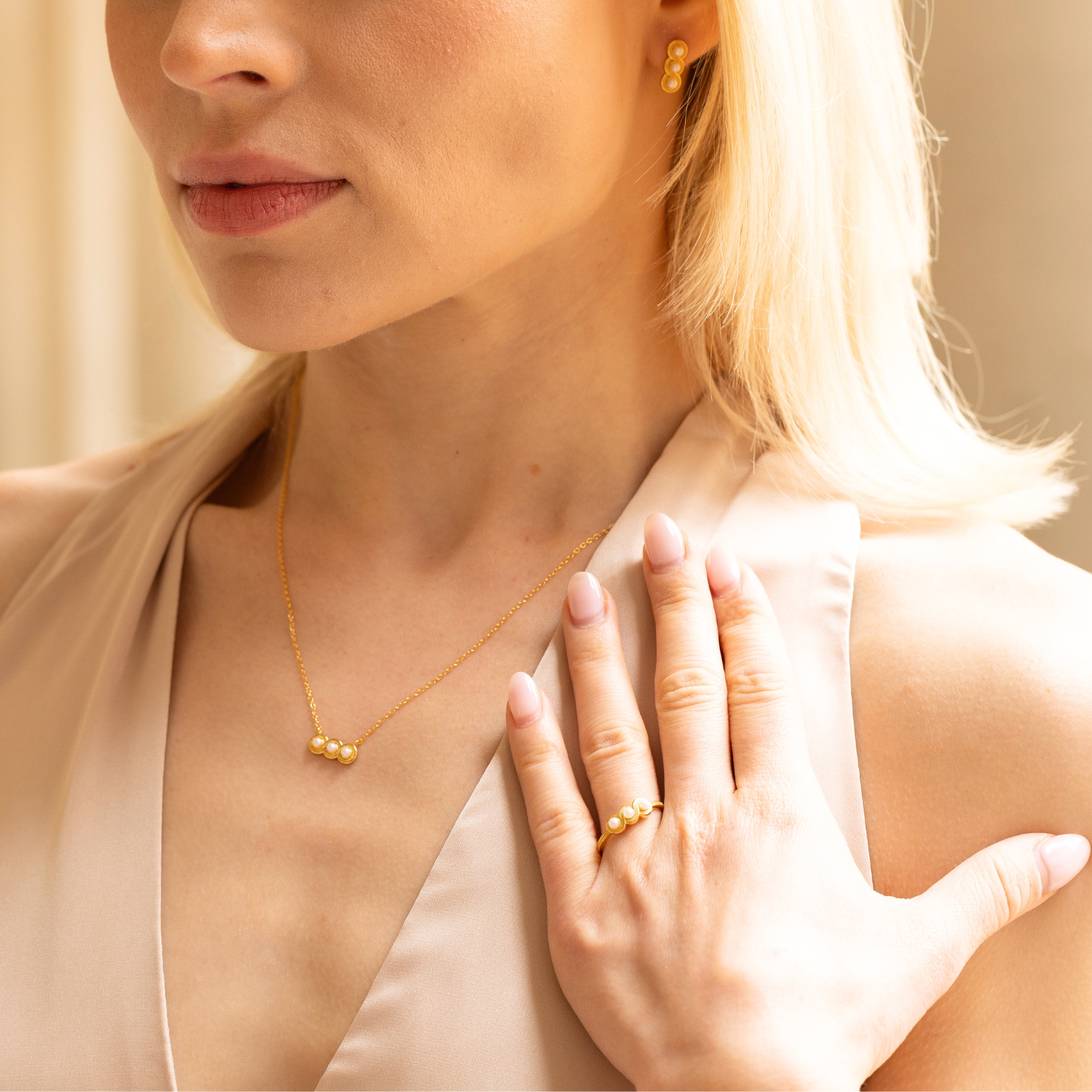 model wearing 18k gold plated sterling silver pearls jewellery set