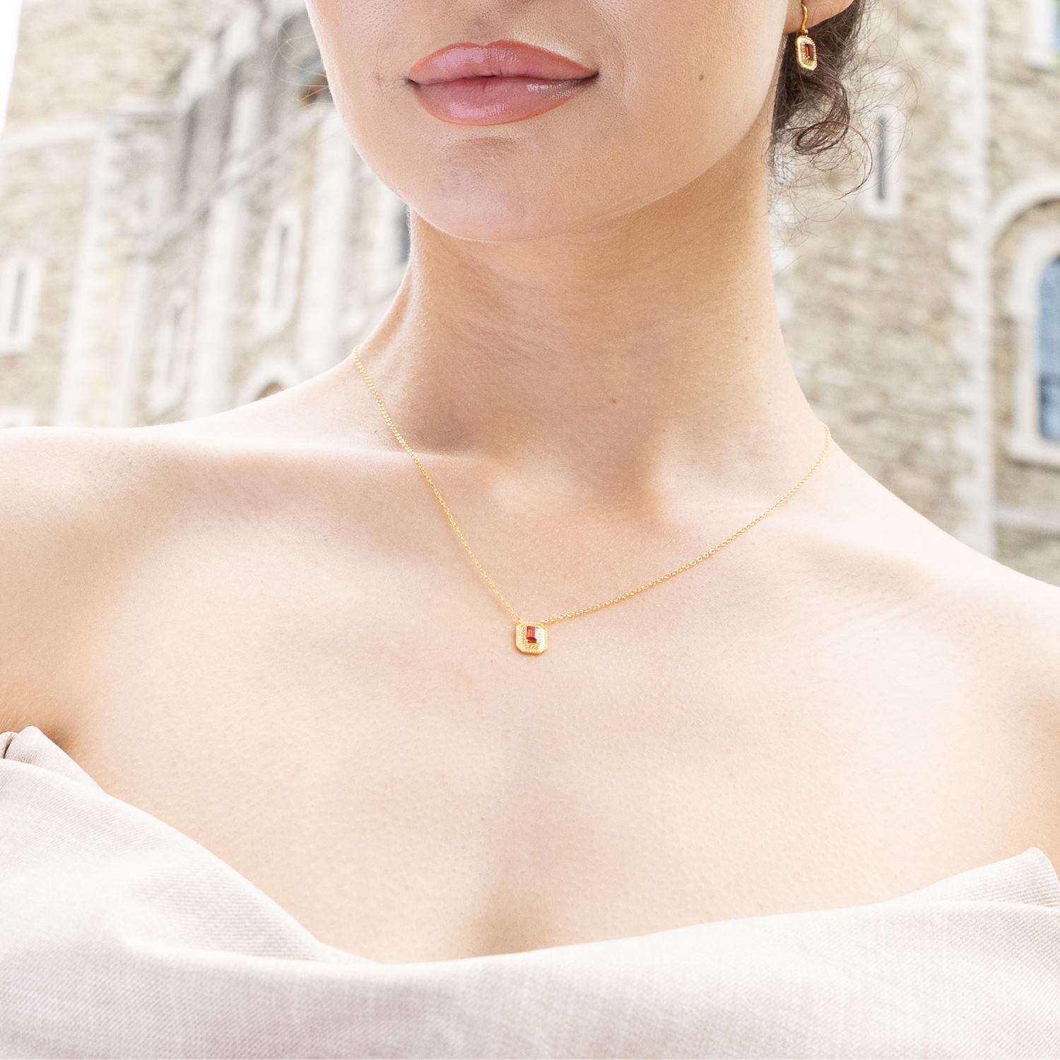 model wearing 18k gold plated sterling silver garnet orb necklace