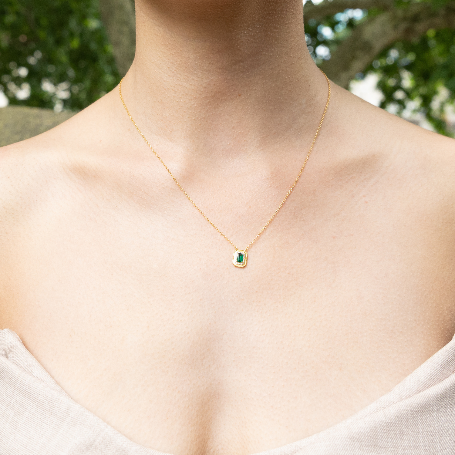 model wearing 18k gold plated sterling silver moissanite necklace