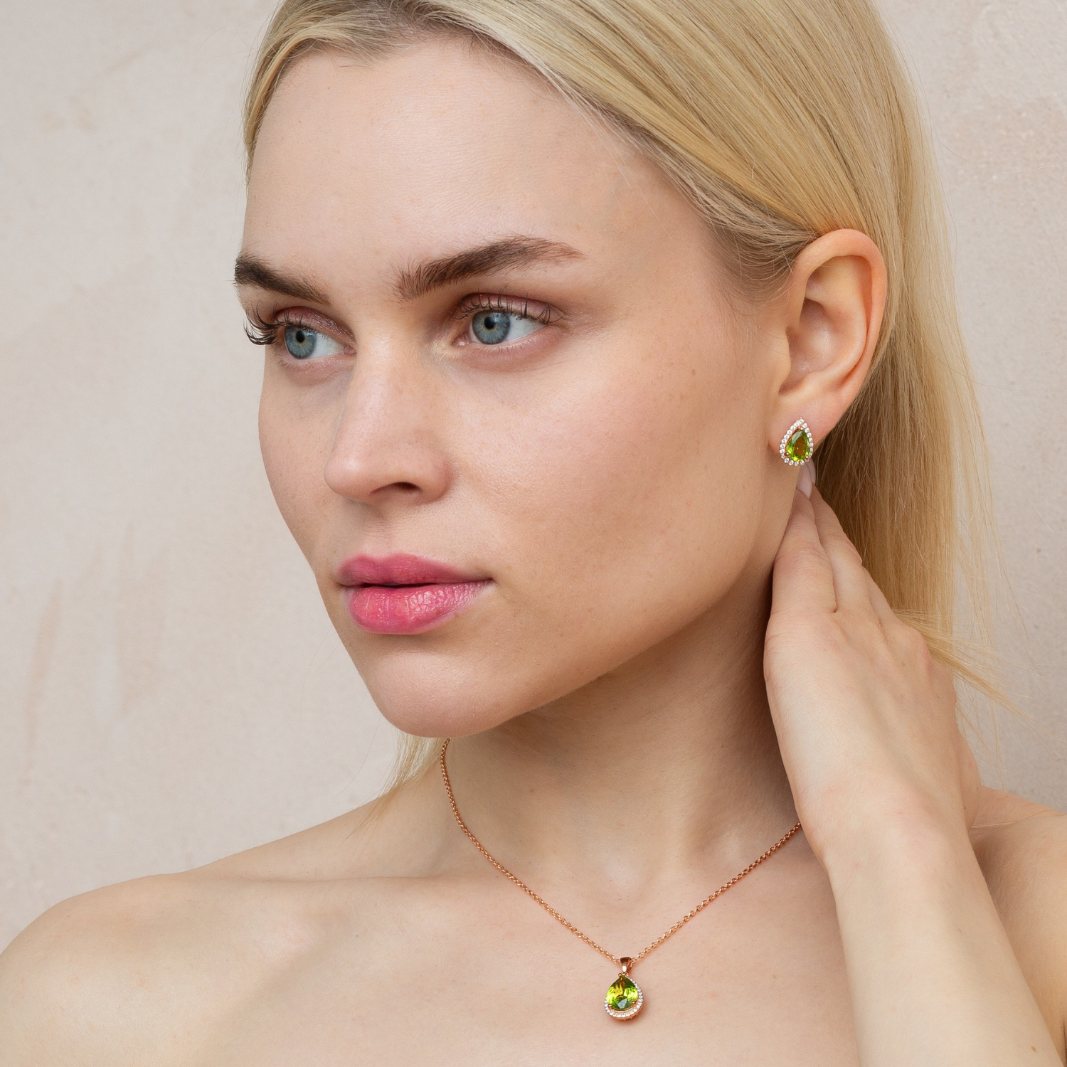 model wearing 18k rose gold 925 sterling silver pear drop peridot necklace