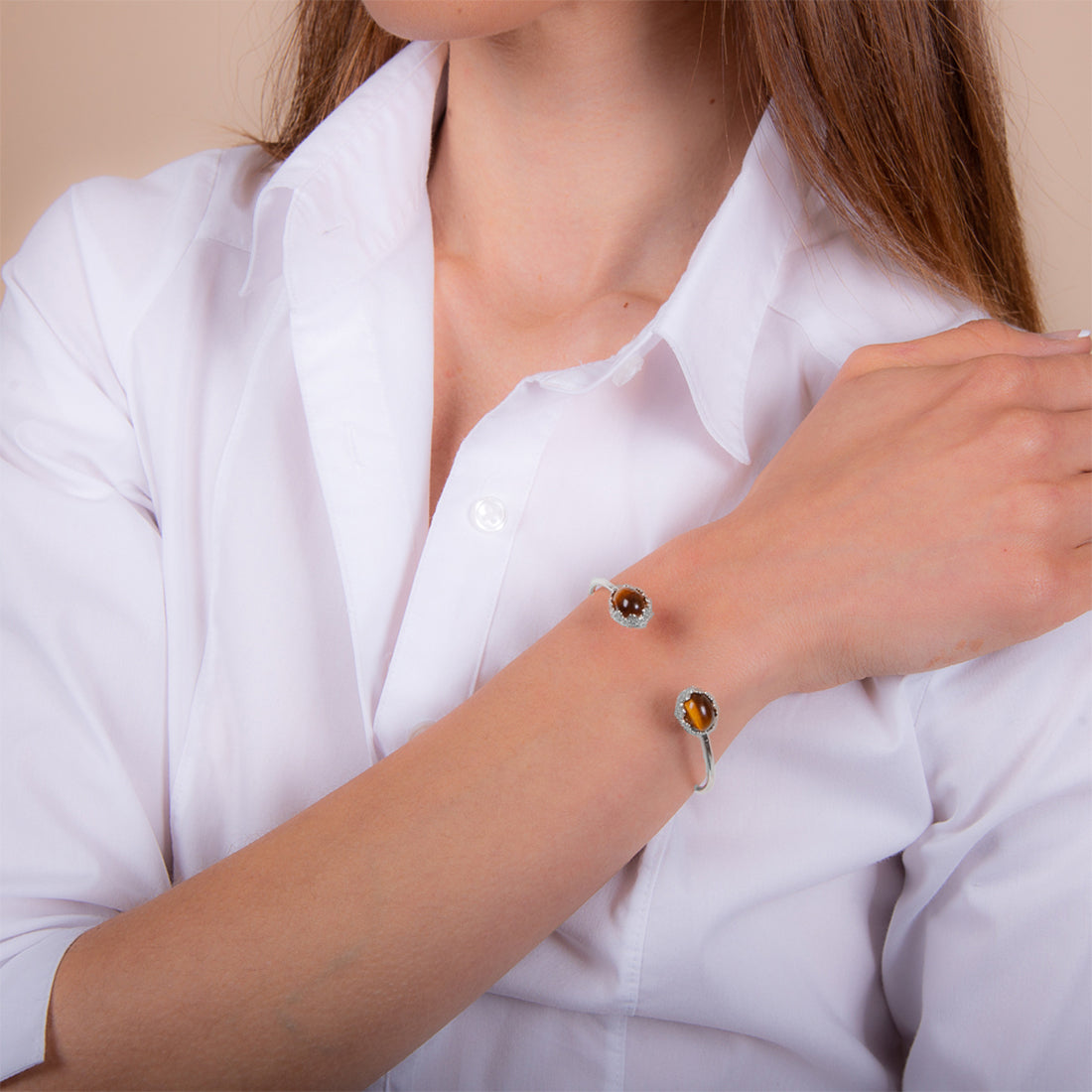 Model wearing 925 sterling silver tiger eye bangle