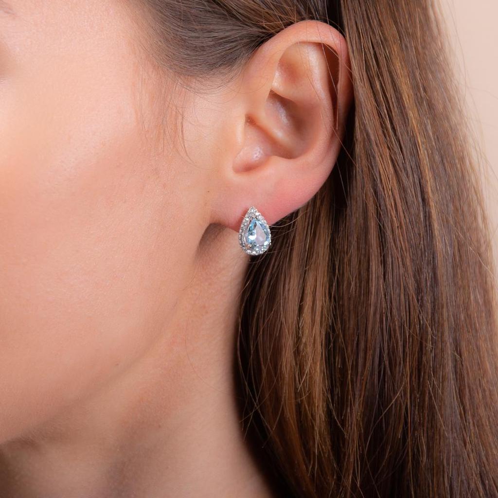 luscious blue topaz rose gold earrings