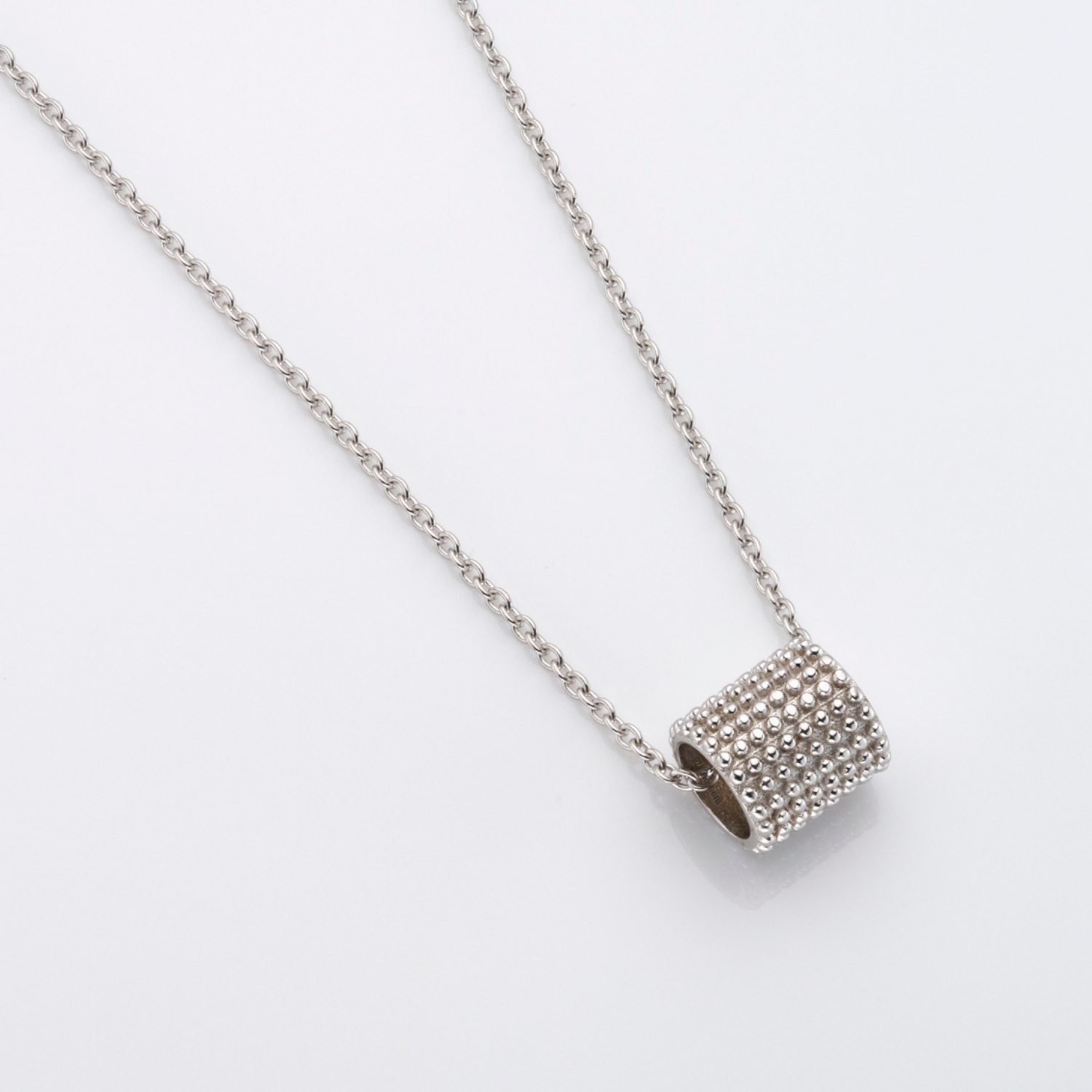 rhodium plated sterling silver barrel pendant