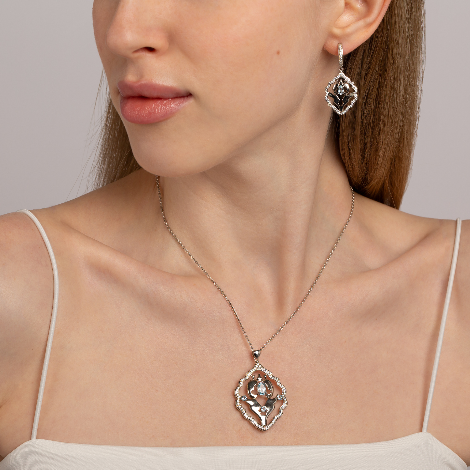 Model wearing 925 sterling silver blue topaz Iznik necklace