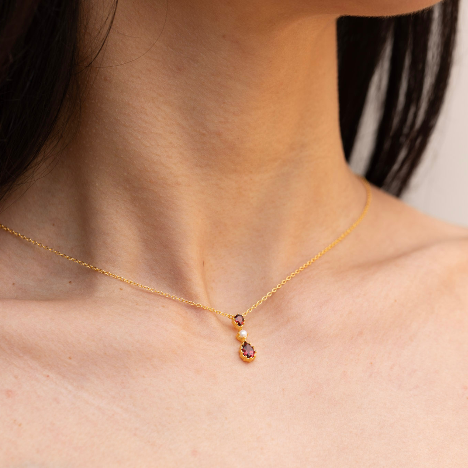 model wearing 18k gold plated sterling silver garnet tiara necklace