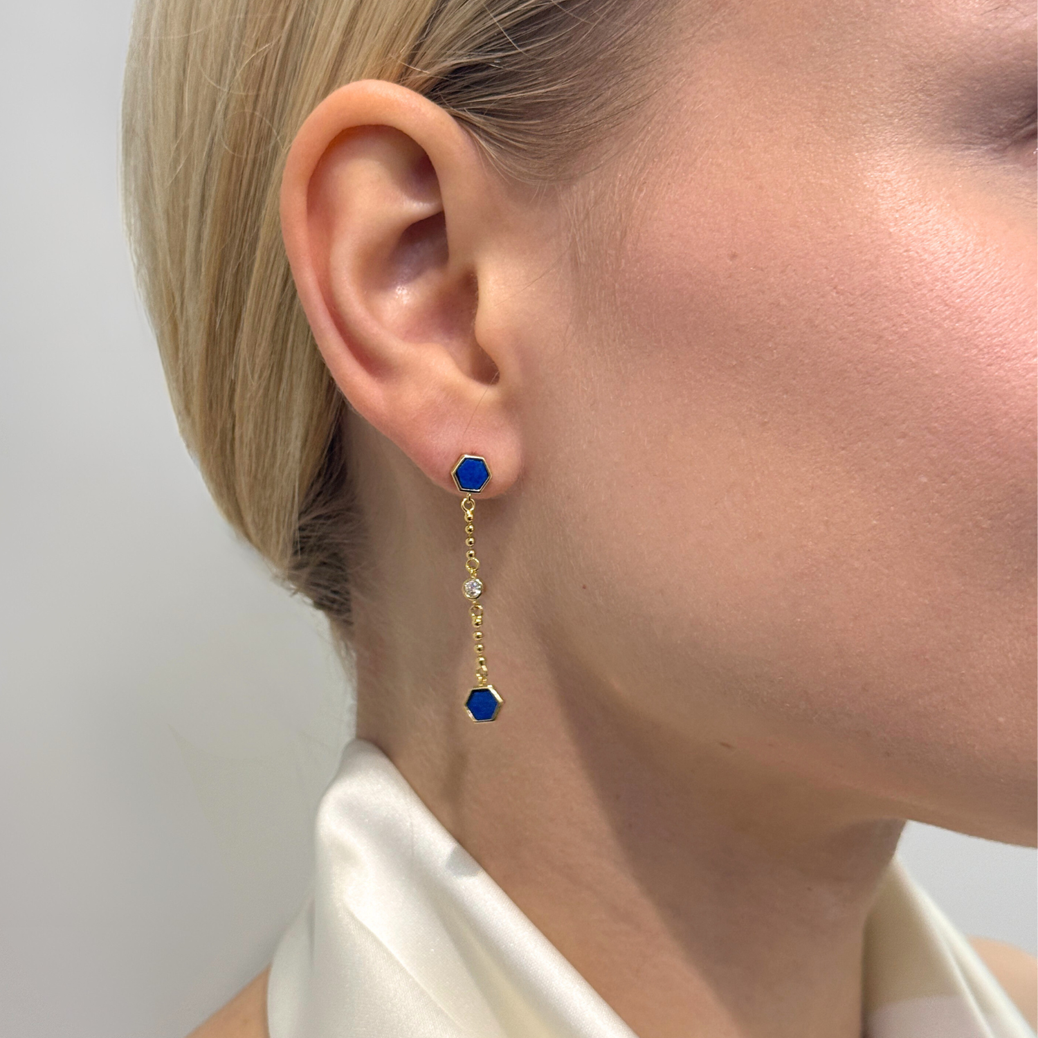model wearing 18k gold plated 925 sterling silver lapis lazuli drop earrings