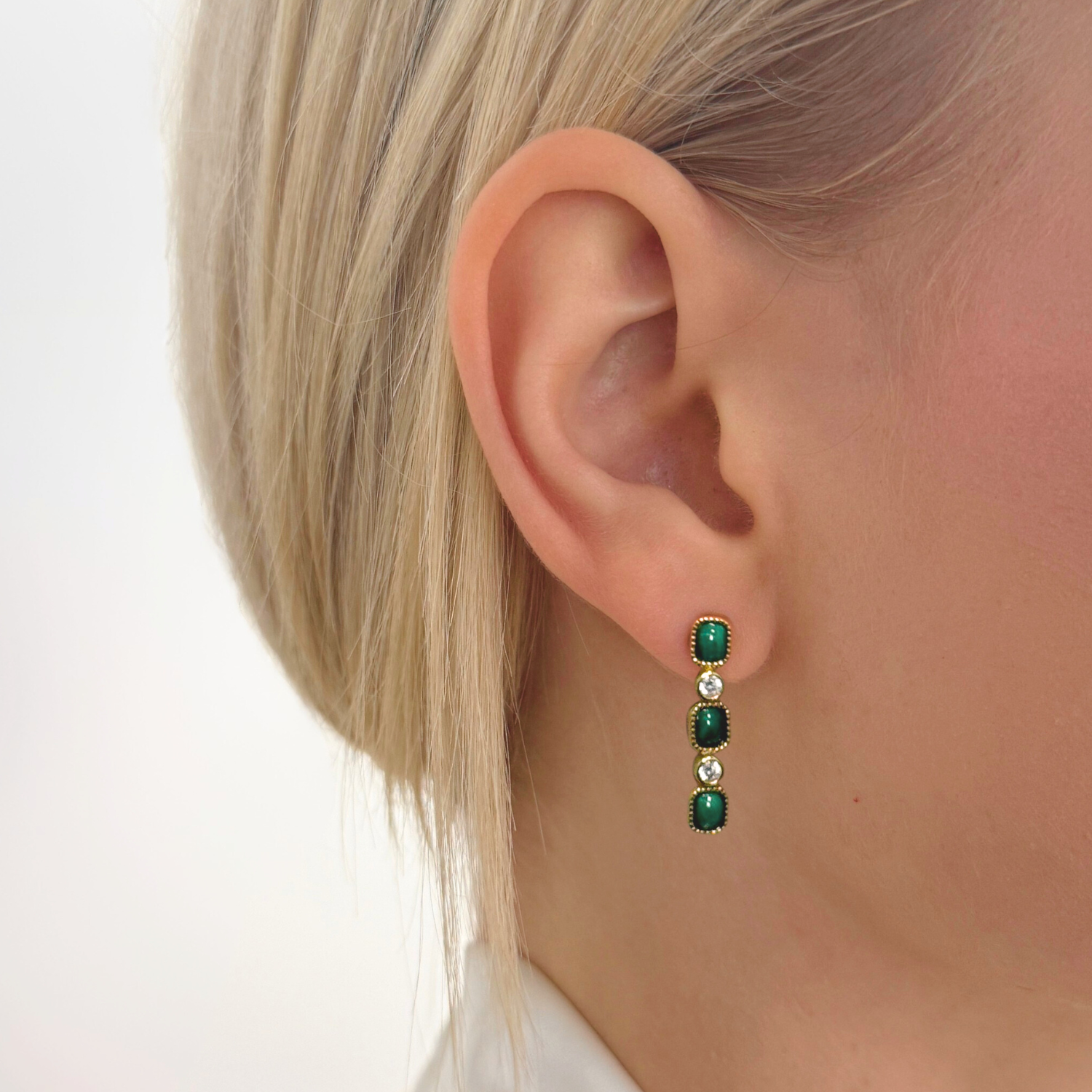 model wearing gold malachite drop earrings
