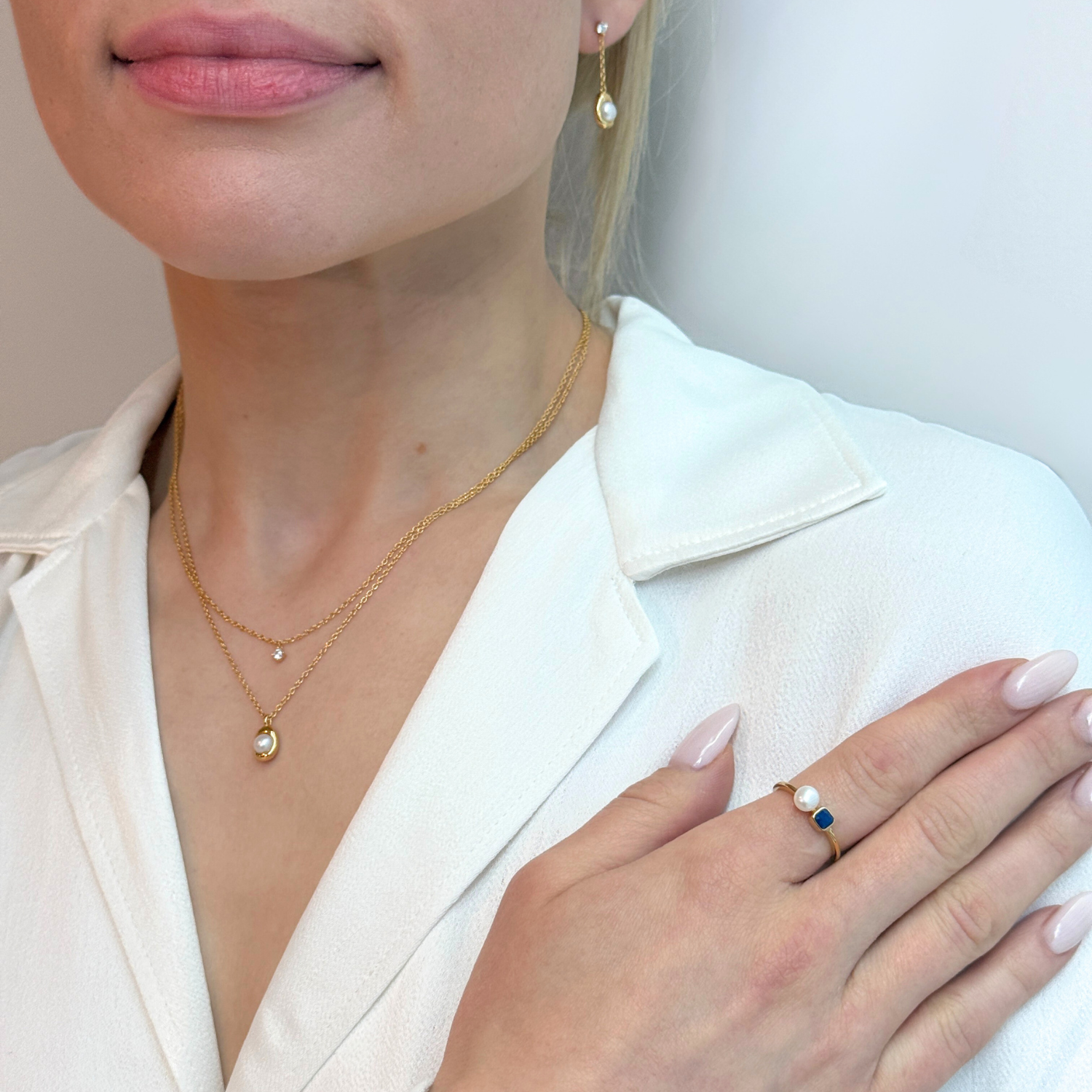 model wearing 18k gold plated 925 sterling silver lapis lazuli pearl ring