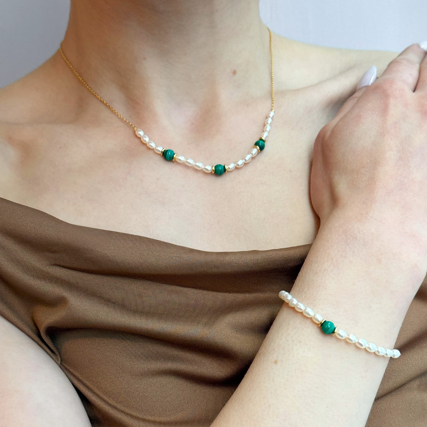 model wearing 18k gold 925 sterling silver pearl malachite bracelet
