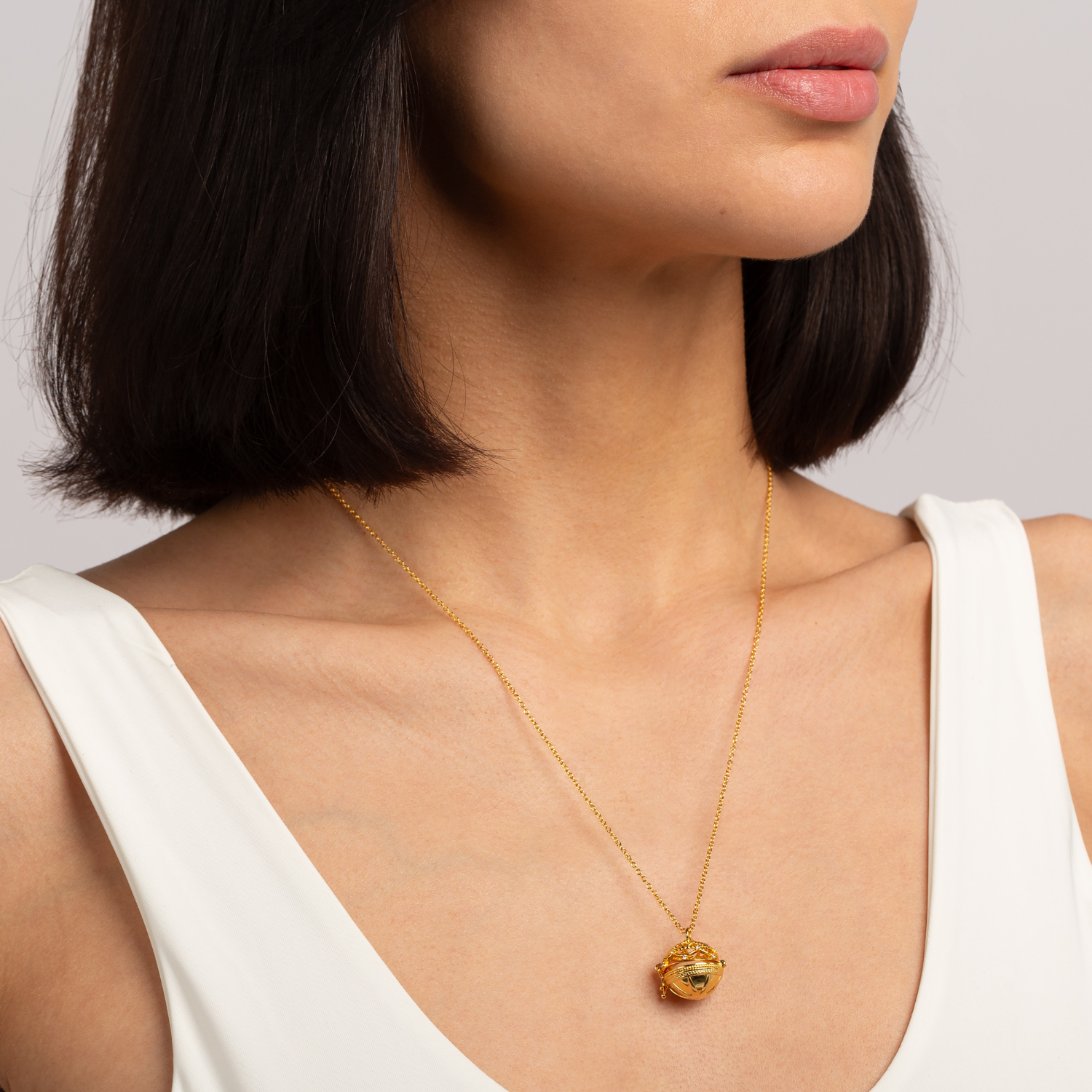 model wearing 18k gold plated 925 sterling silver pearl orb necklace