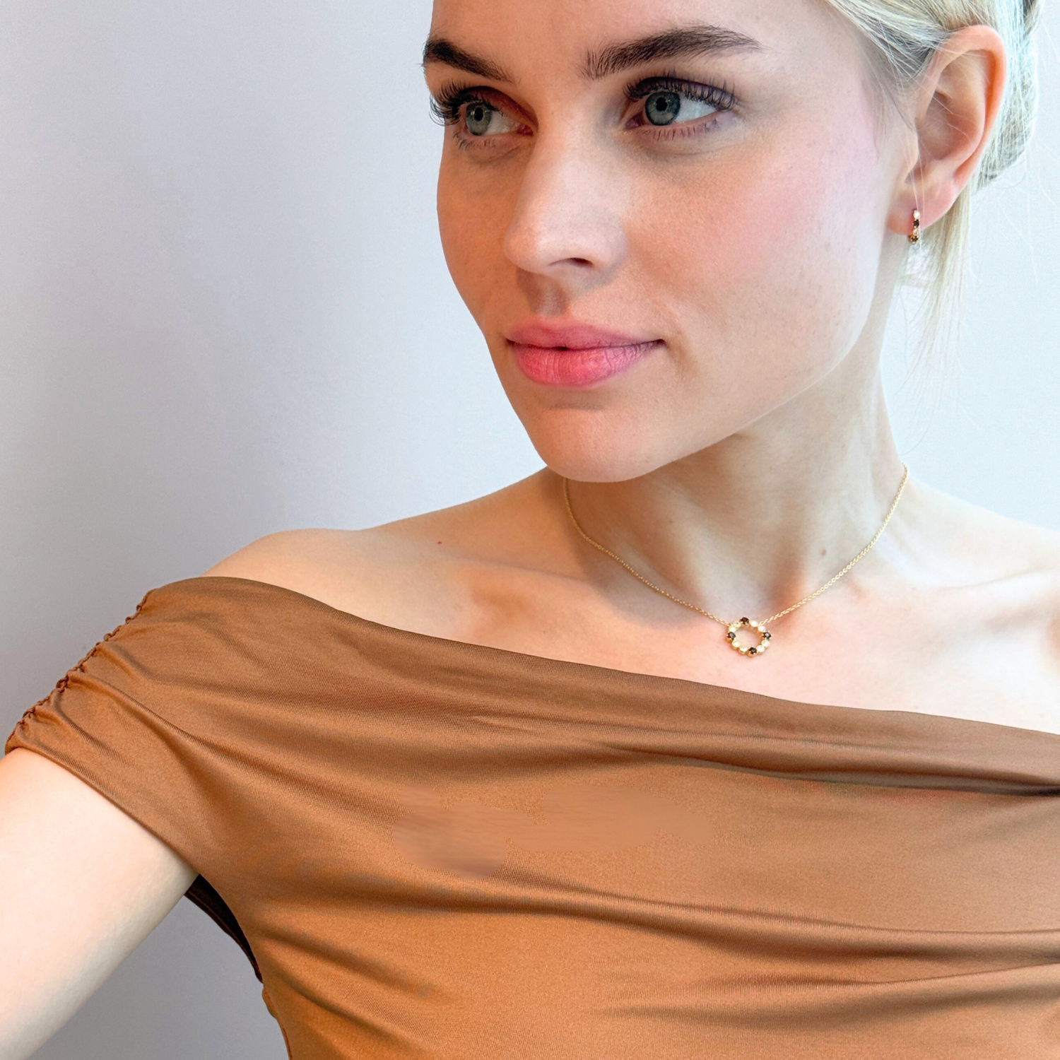 model wearing 18k gold 925 sterling silver round garnet necklace