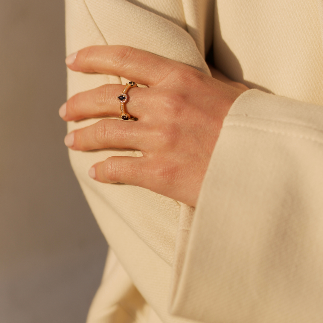 model wearing 18k gold 925 sterling silver sapphire stacking ring