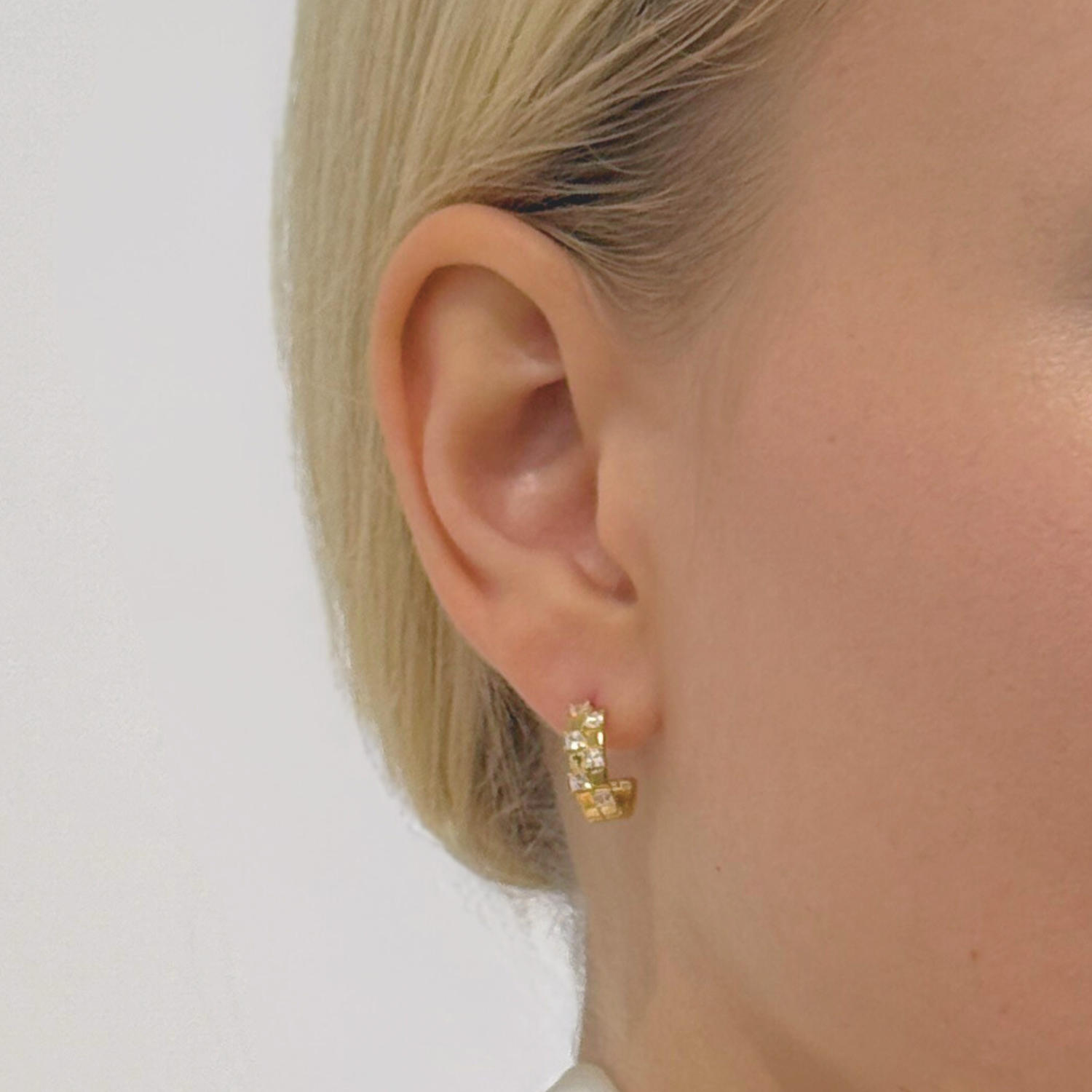 model wearing 18k gold plated 925 sterling silver square mini hoops