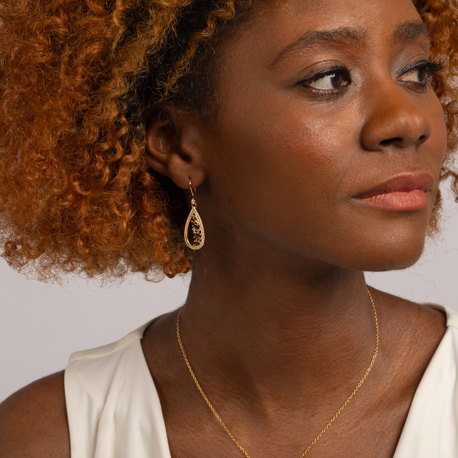 model wearing 18k gold 925 sterling silver tourmaline drop earrings