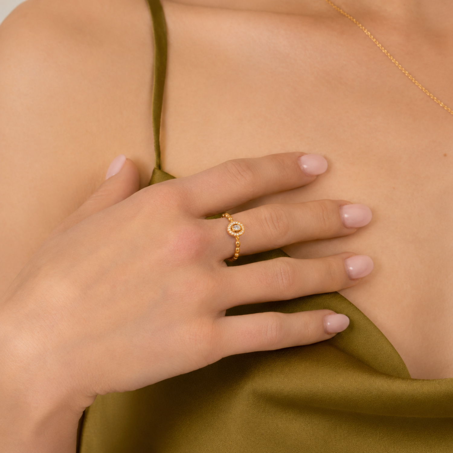 model wearing 18k gold plated sterling silver cubic zirconia ring