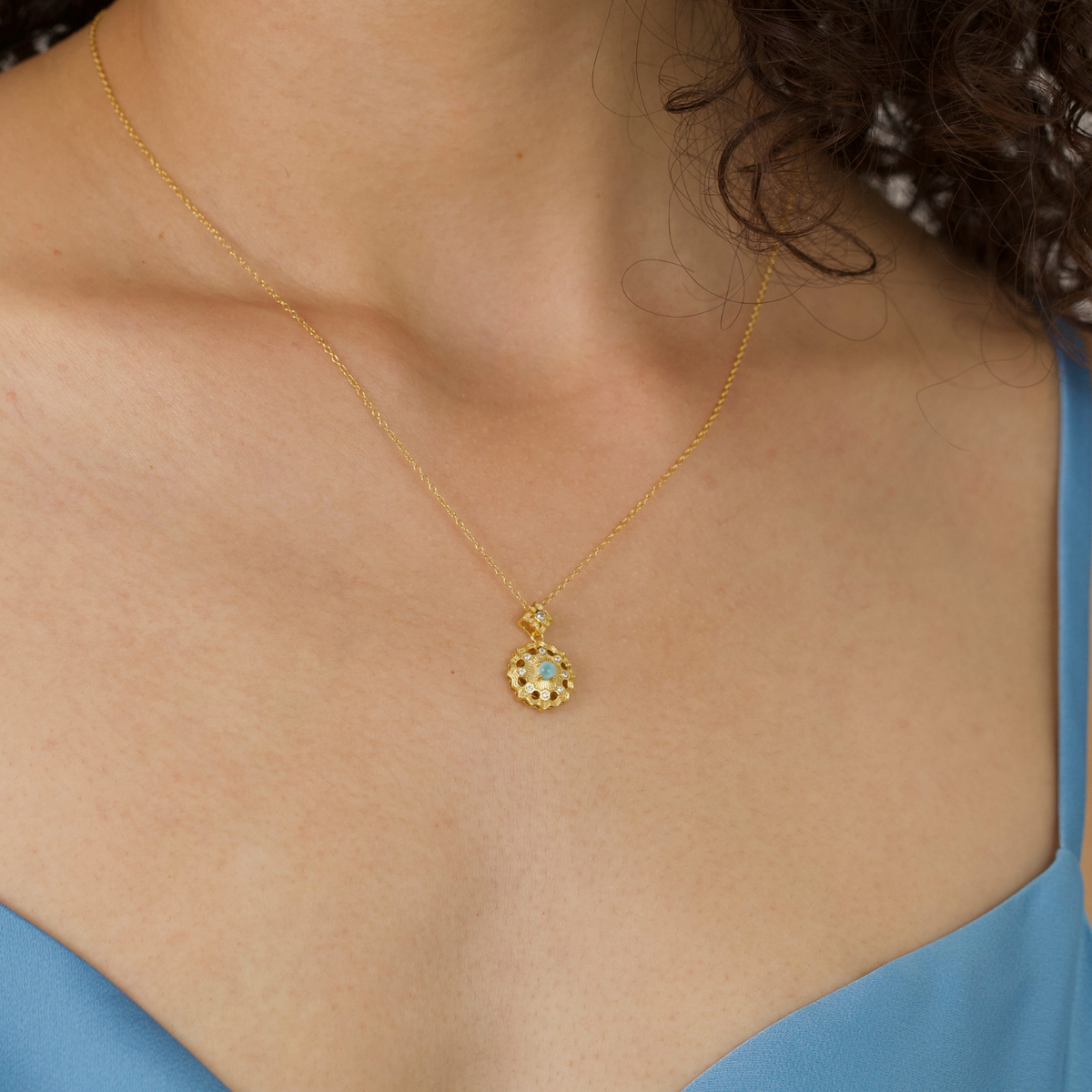 model wearing 18k gold plated sterling silver blue larimar necklace