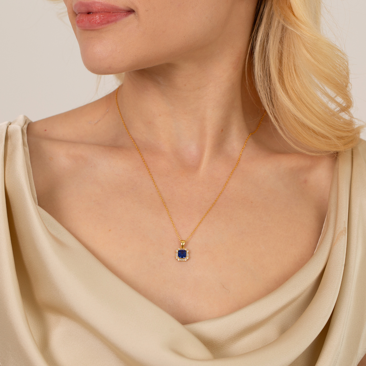 model wearing 18k gold plated sterling silver sapphire necklace