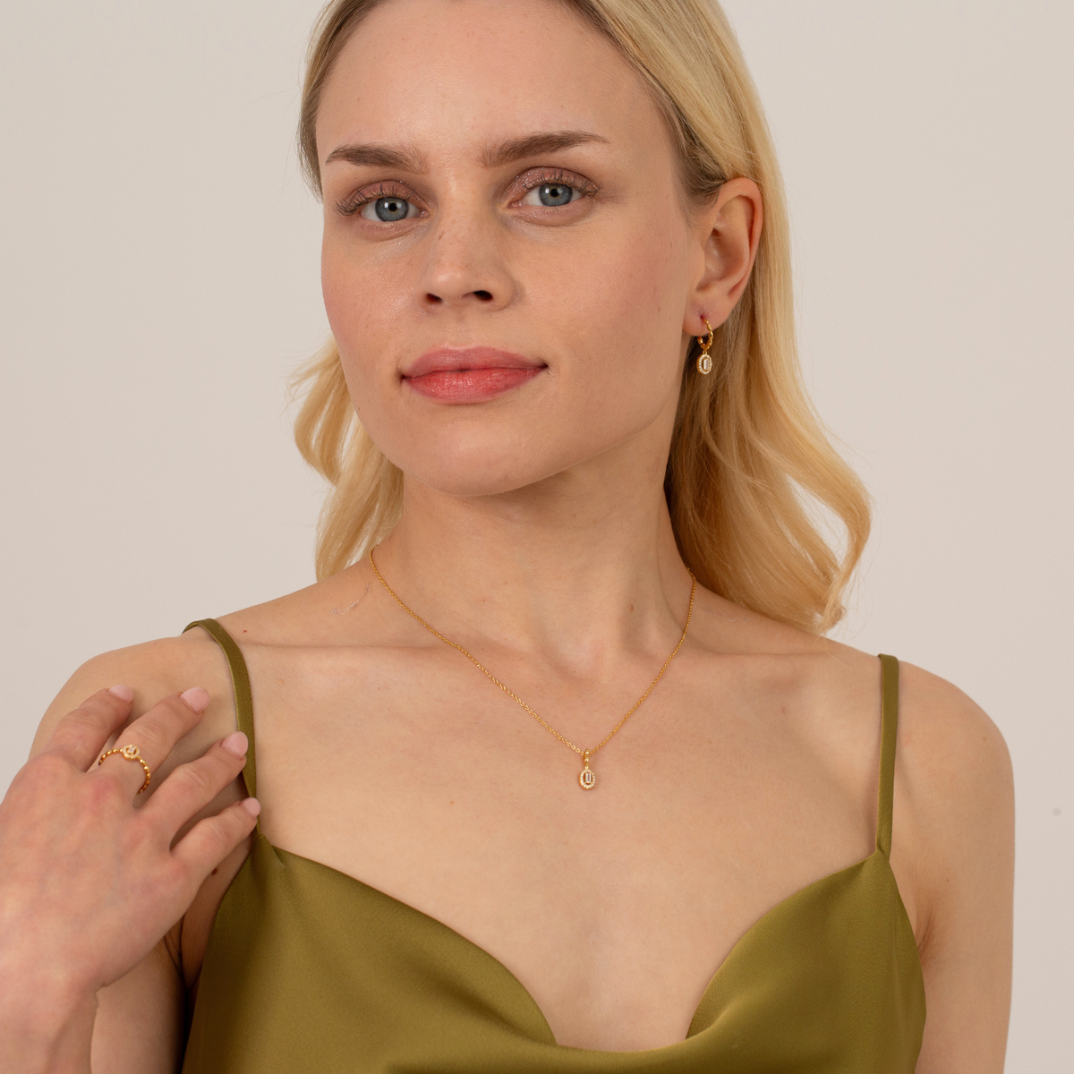 model wearing 18k gold plated sterling silver cubic zirconia necklace earrings ring