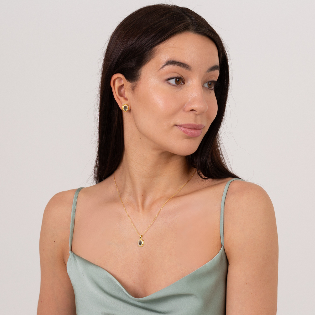 model wearing 18k gold plated sterling silver moss agate necklace and earrings