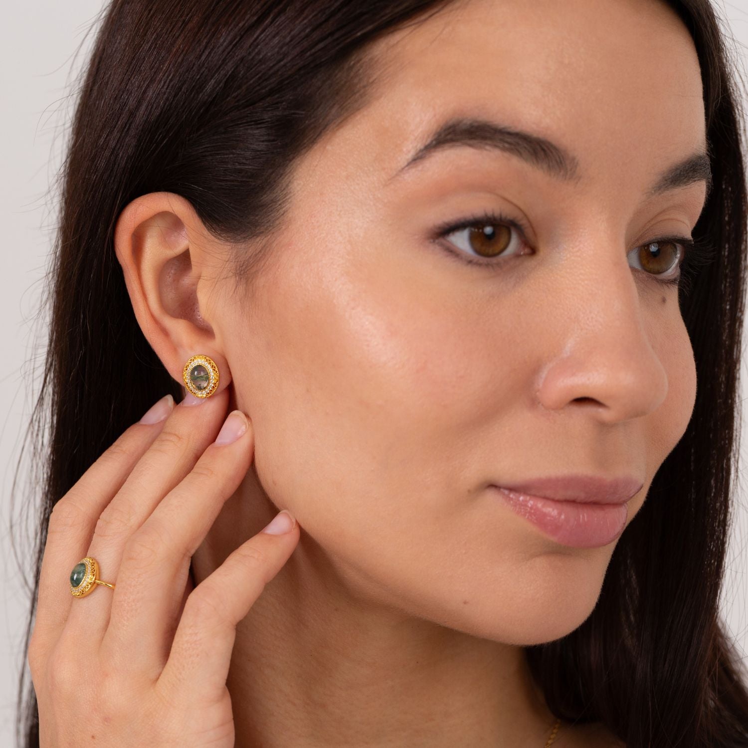model wearing 18k gold plated sterling silver moss agate earrings and ring