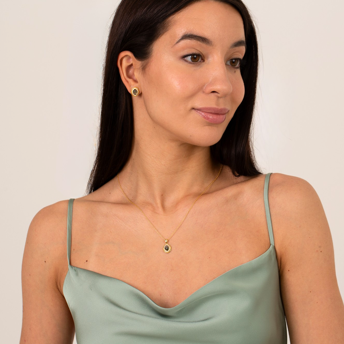 model wearing 18k gold plated sterling silver moss agate oval earrings and necklace