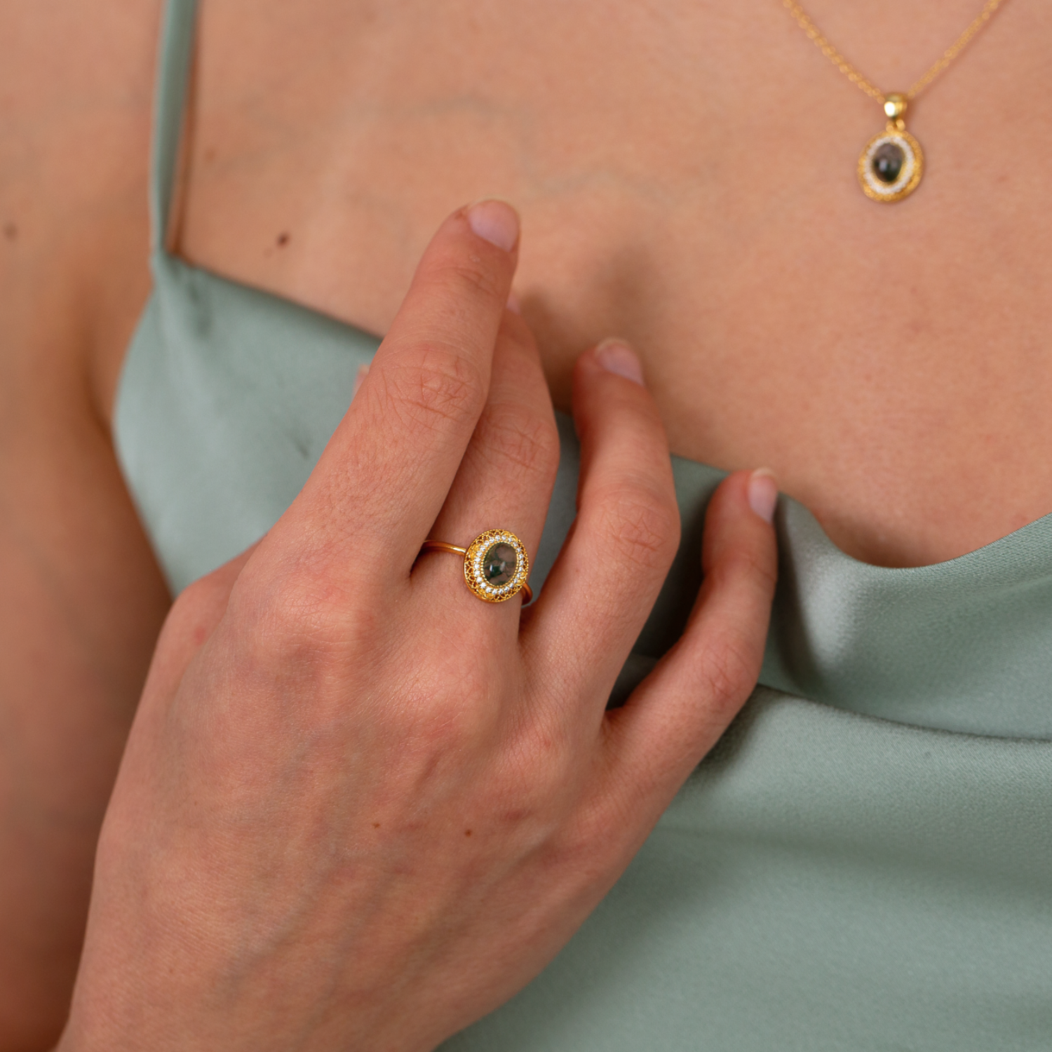 model wearing 18k gold plated sterling silver moss agate ring and necklace