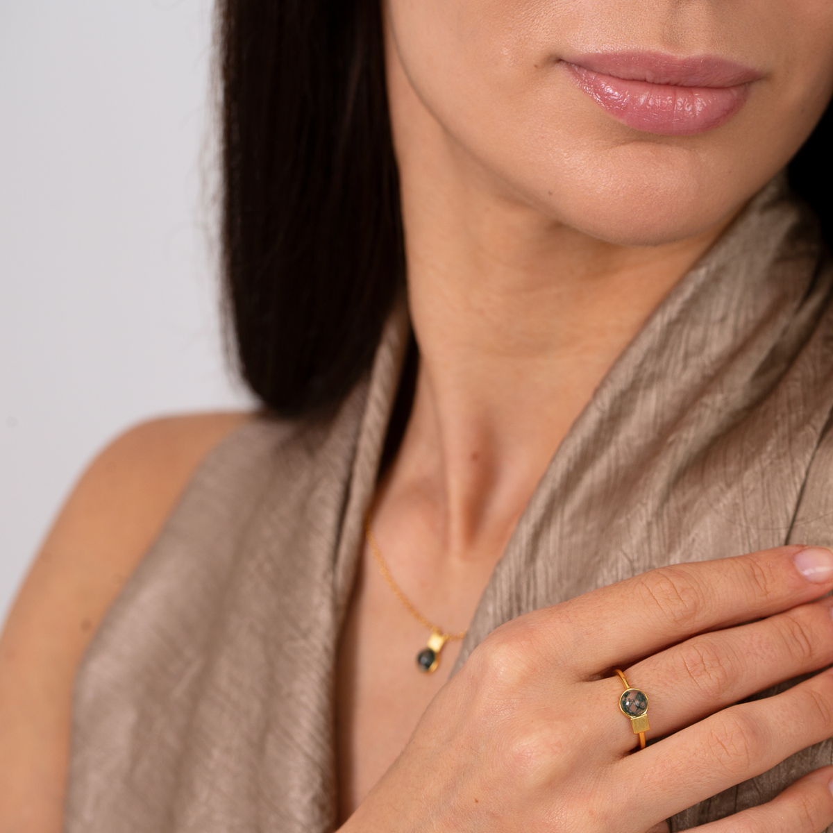 model wearing 18k gold plated sterling silver moss agate ring and necklace