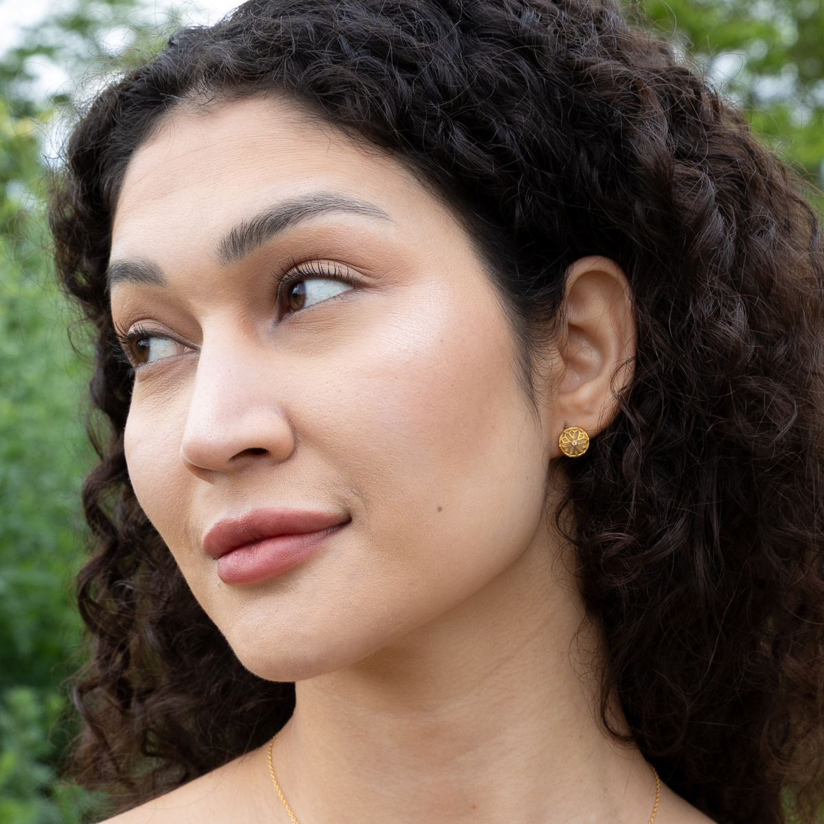 model wearing 18k gold plated sterling silver mother of pearl wolsey earrings