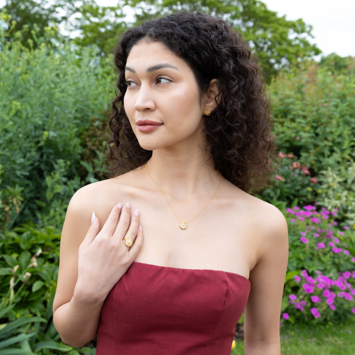 model wearing 18k gold plated sterling silver mother of pearl jewellery set