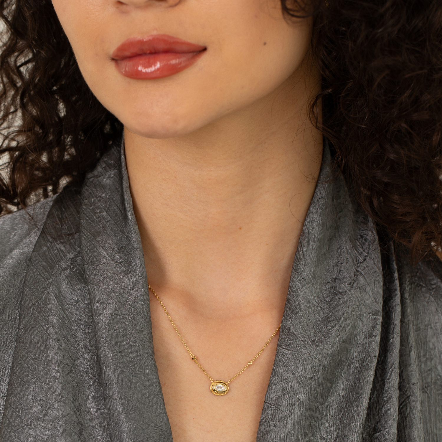 model wearing 18k gold plated sterling silver oval cubic zirconia necklace