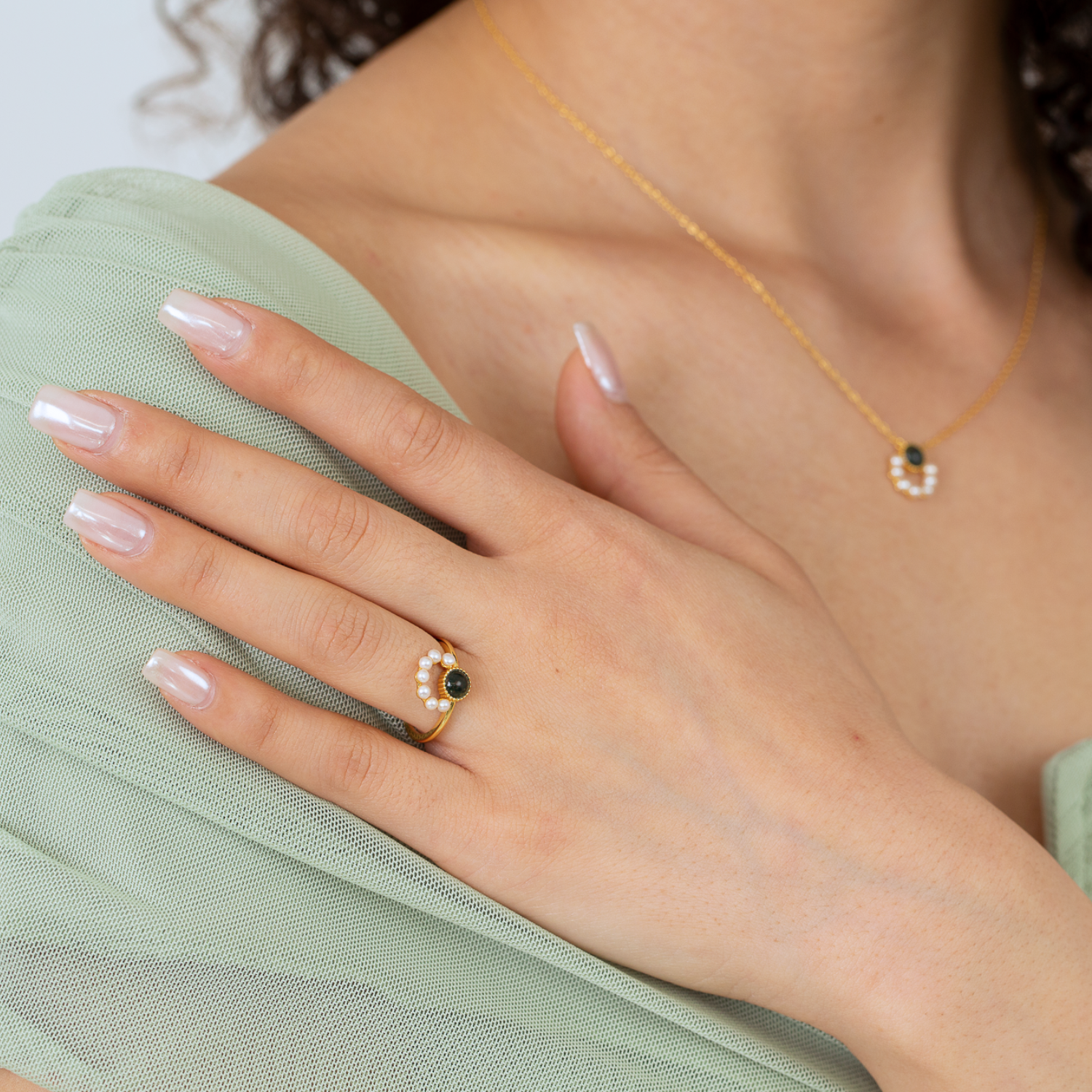 model wearing 18k gold plated sterling silver pearl moss agate jewellery set