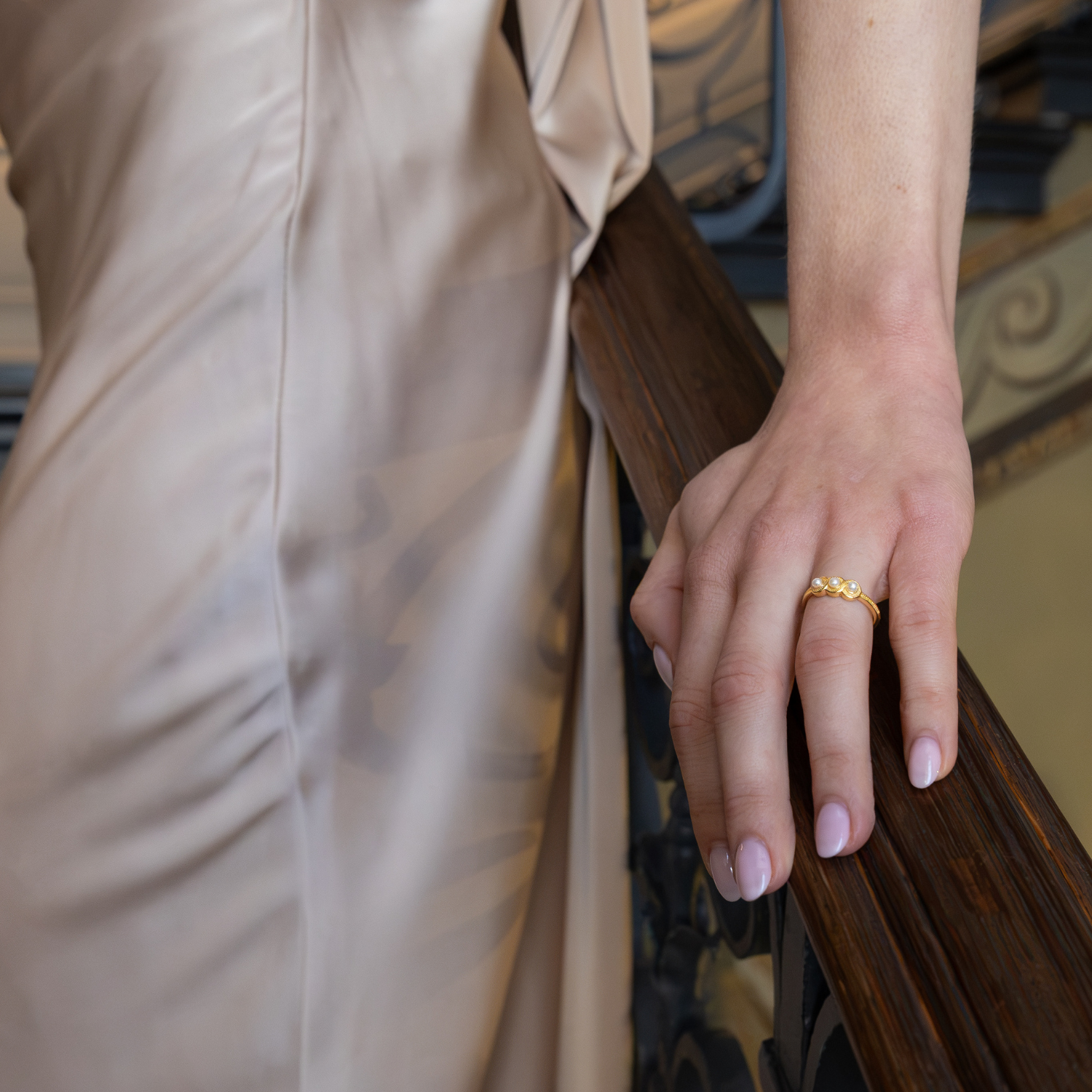 model wearing 18k gold plated sterling silver pearls ring