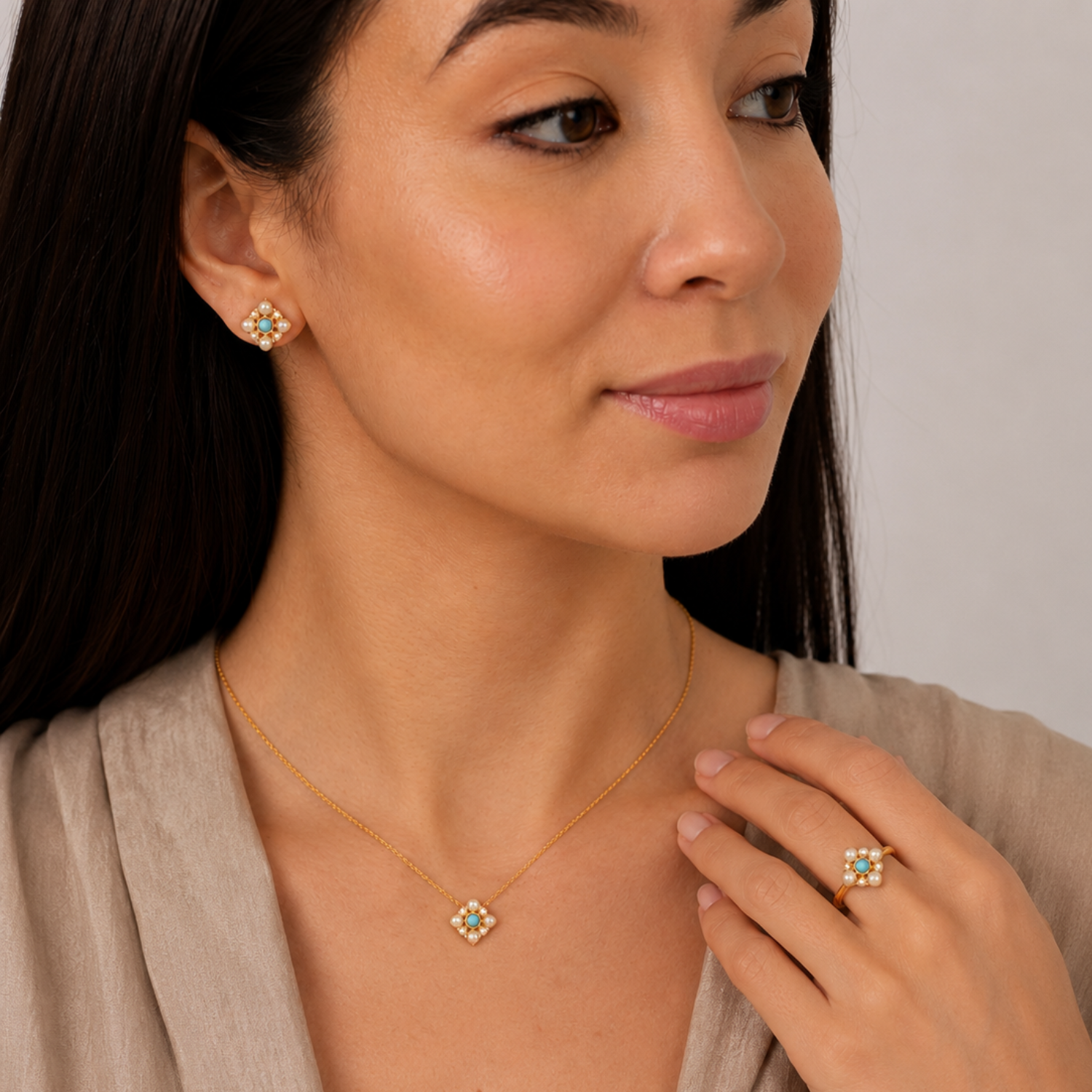 model wearing 18k gold plated sterling silver turquoise pearl jewellery set