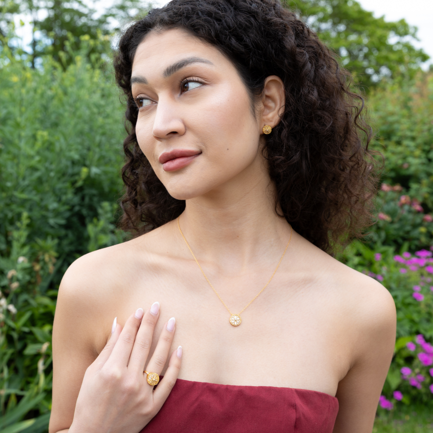 model wearing 18k gold plated sterling silver mother of pearl ring, necklace and earrings