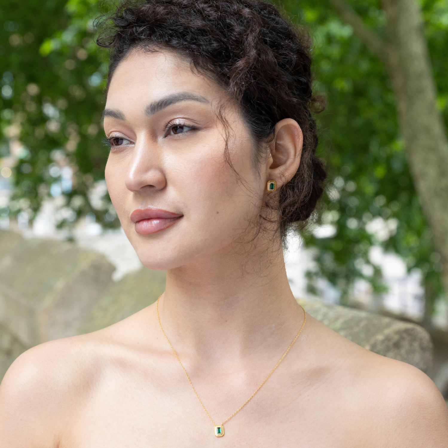 model wearing 18k gold plated sterling silver moissanite stud earrings 