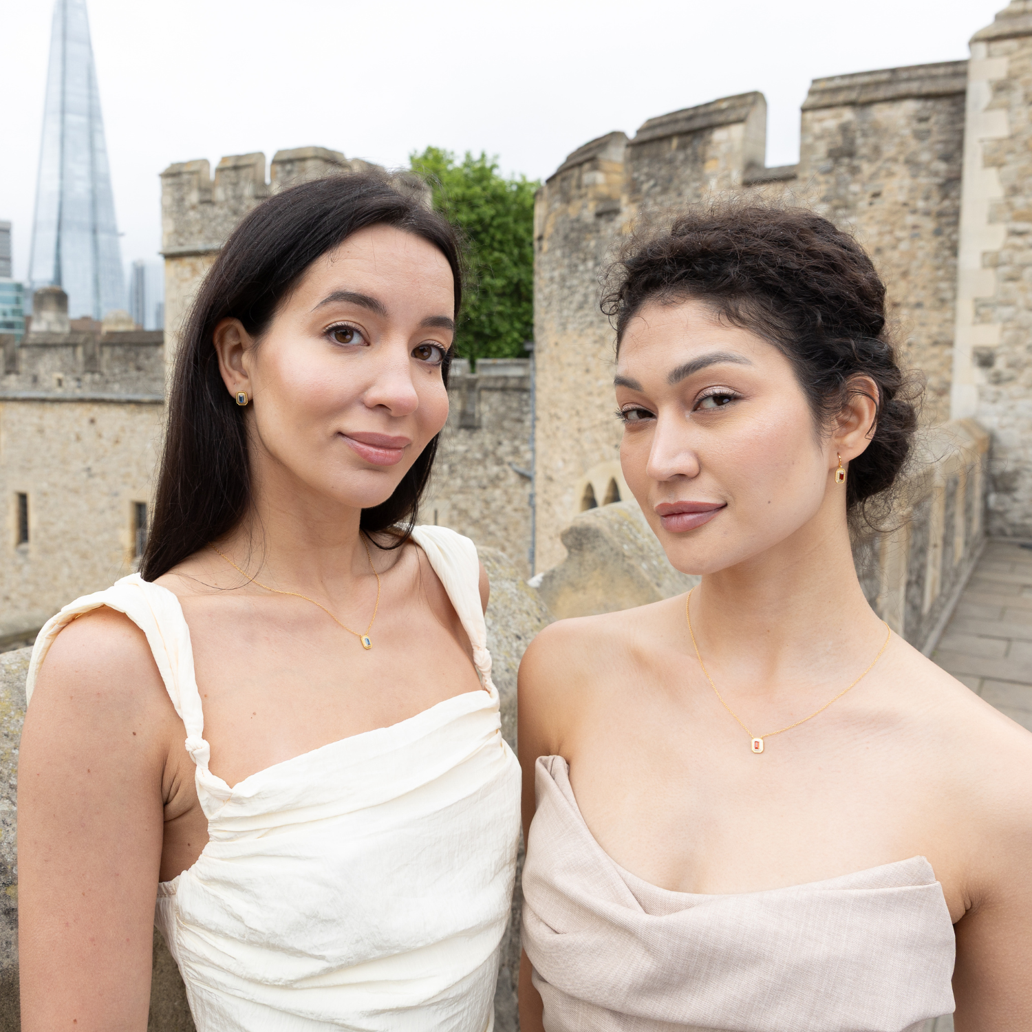 models wearing 18k gold plated sterling silver garnet orb necklace