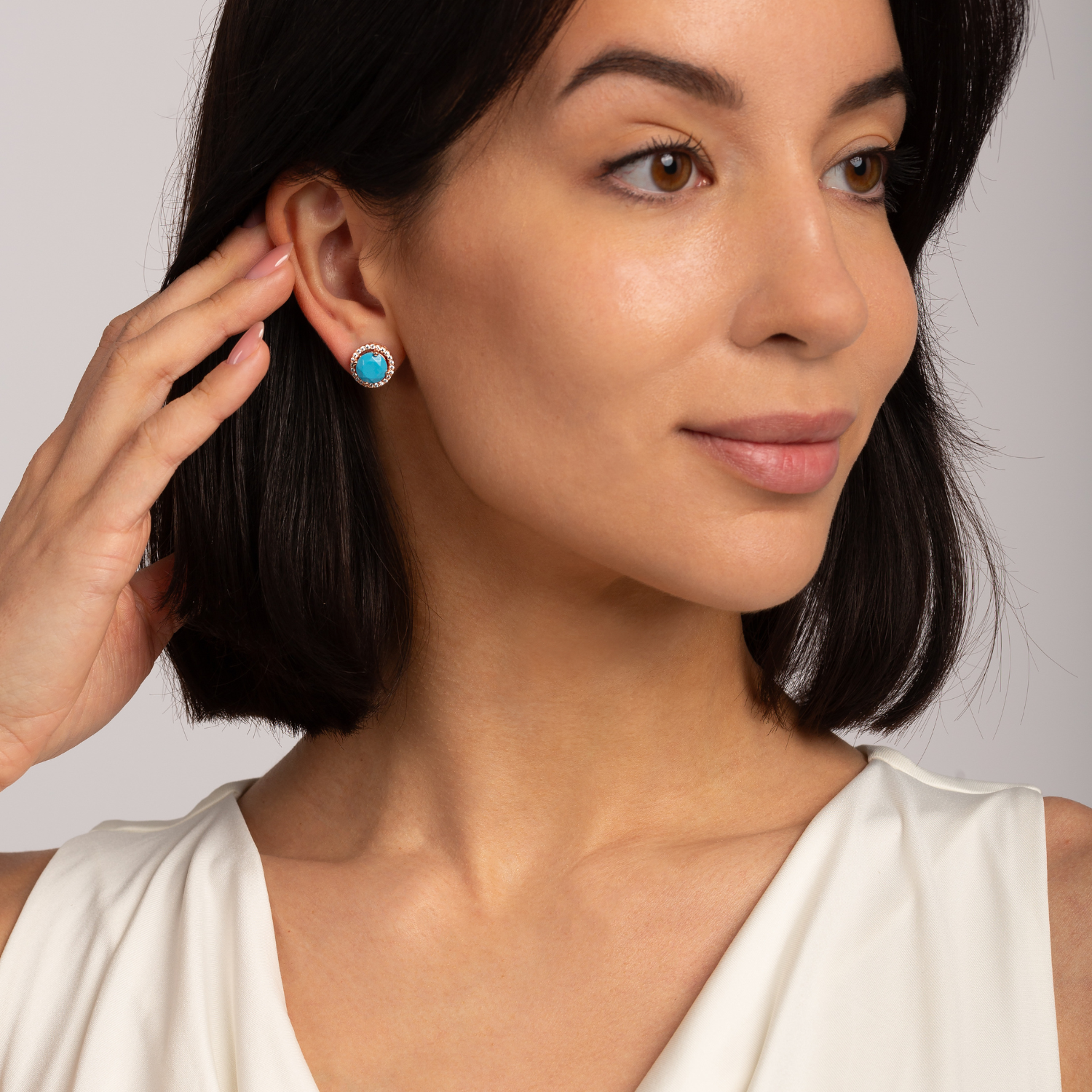 model wearing 18k rose gold 925 sterling silver turquoise stud earrings