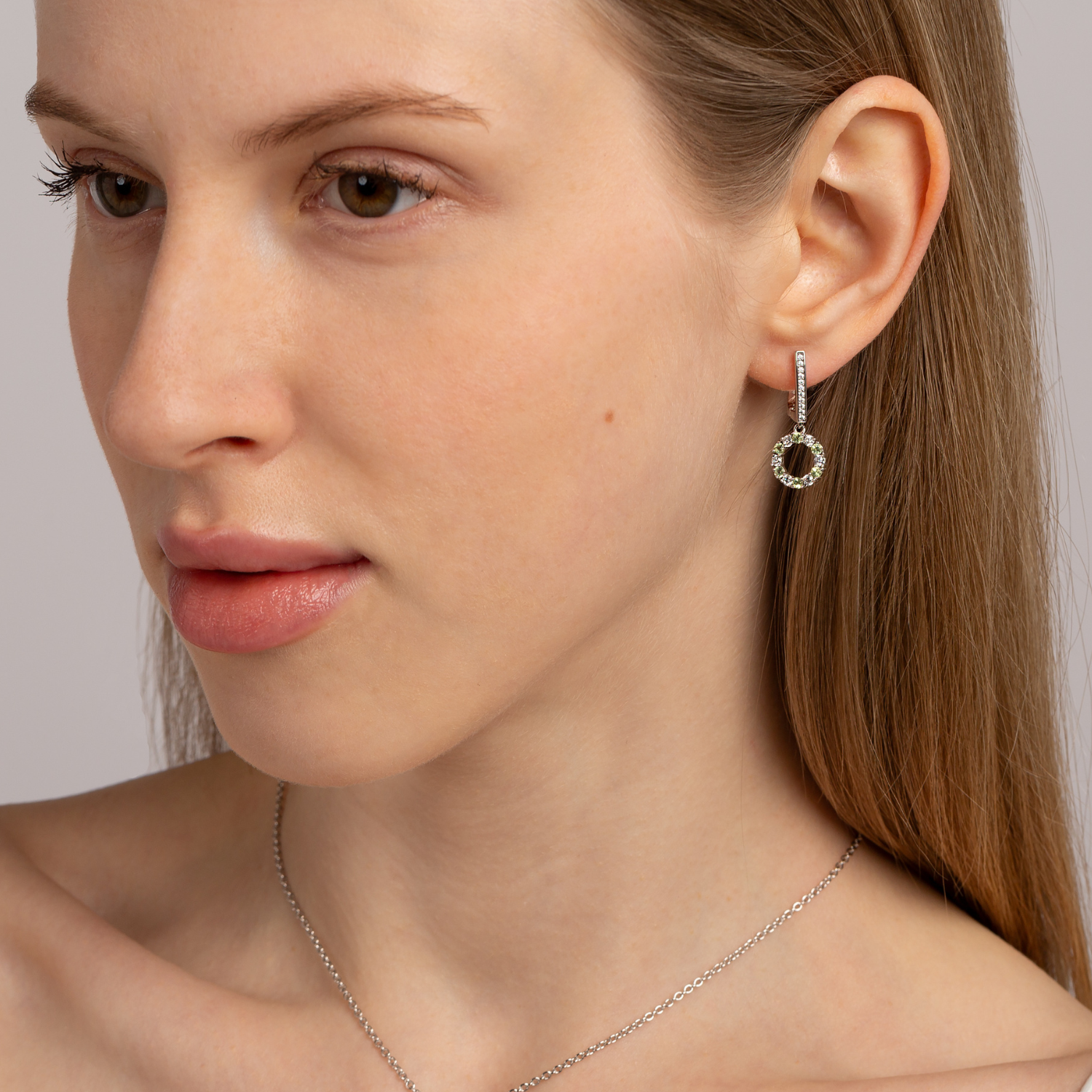 model wearing 925 sterling silver peridot drop earrings