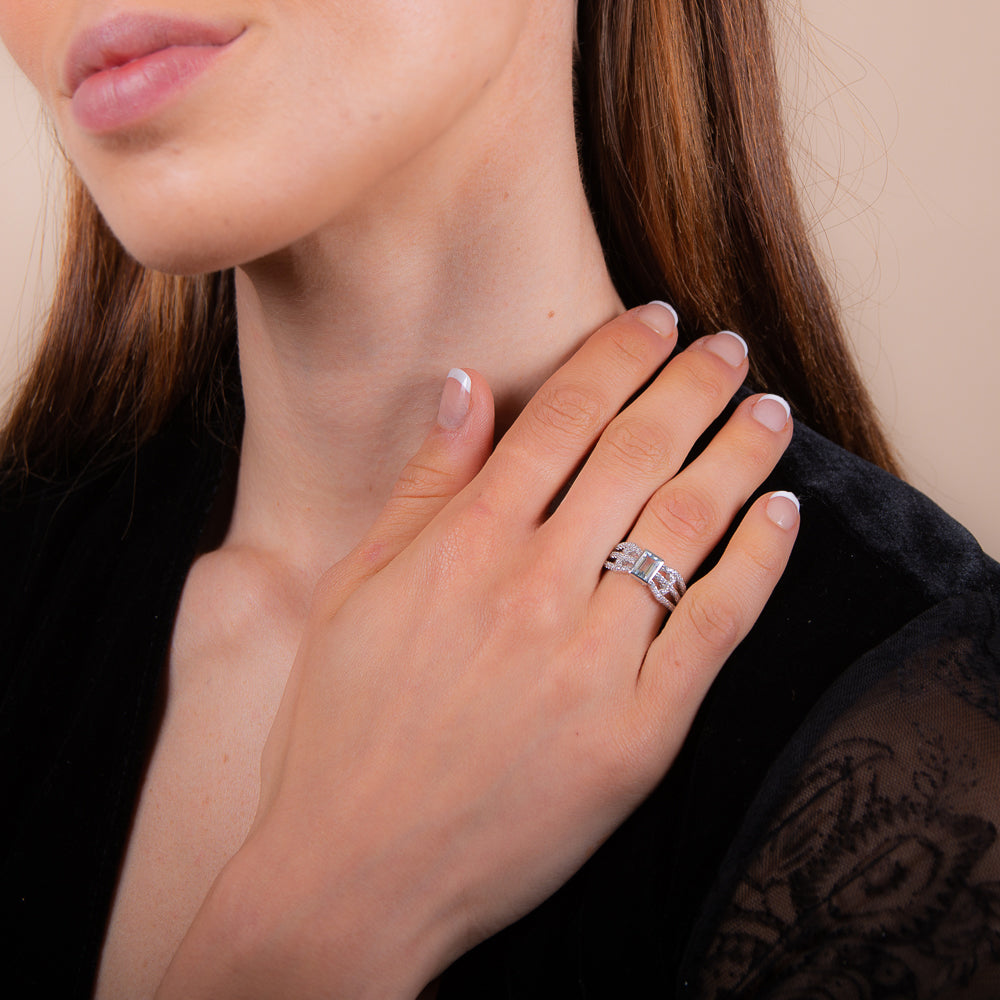 model wearing 925 sterling silver blue topaz sakura ring